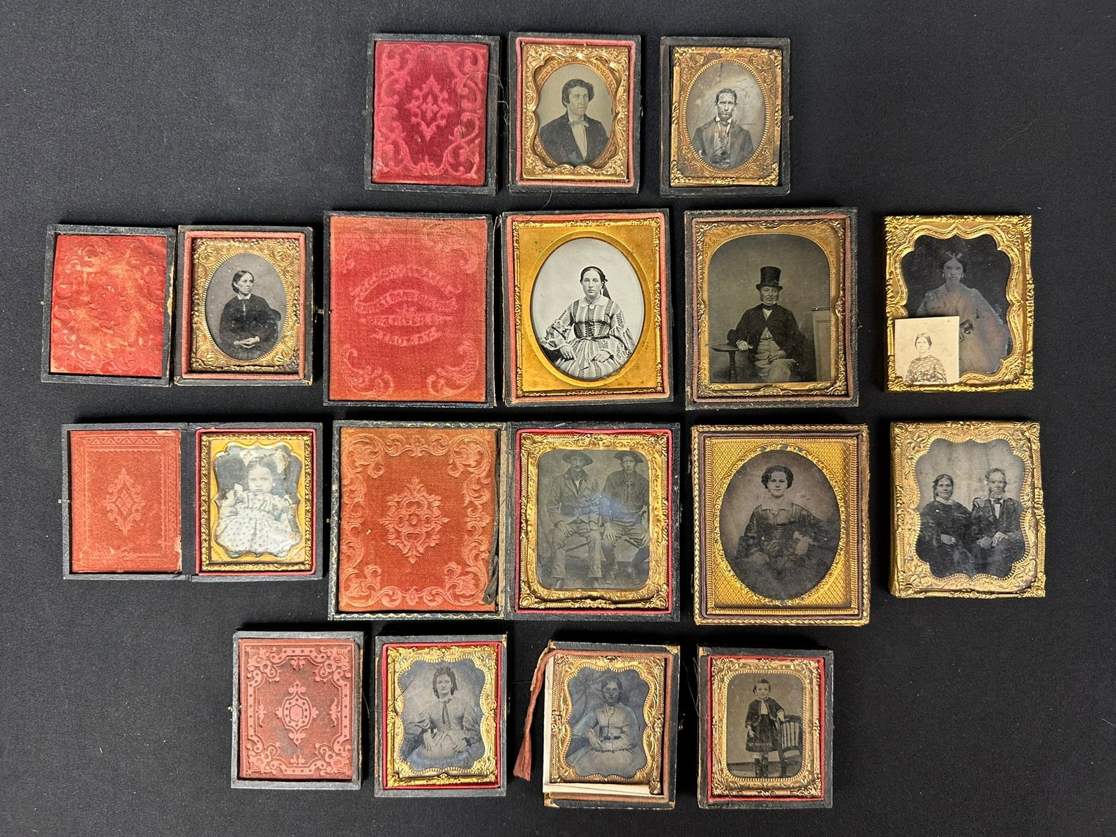 Fantastic Lot of 13 19th Century Ambrotype Daguerreotype Cased Photos Men Women Children Cowboy Gun: Wonderful lot of 13 images featuring 2 cowboy type of characters one has gun on his hip, the others are portaits of men, women and children. Some wonderful antique images. The case of the image of the