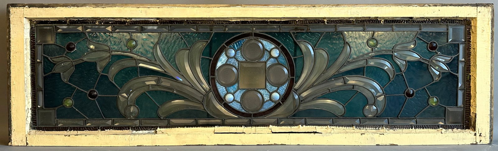 Antique 18 Jewel Multi Color Leaded Stained Glass Window Floral Pattern: This lot is a beautiful 18 jewel, multi color leaded stained glass window. Great painted wood frame, some damage along the bottom row of glass pieces. Many cut pieces of glass make up this beautiful w