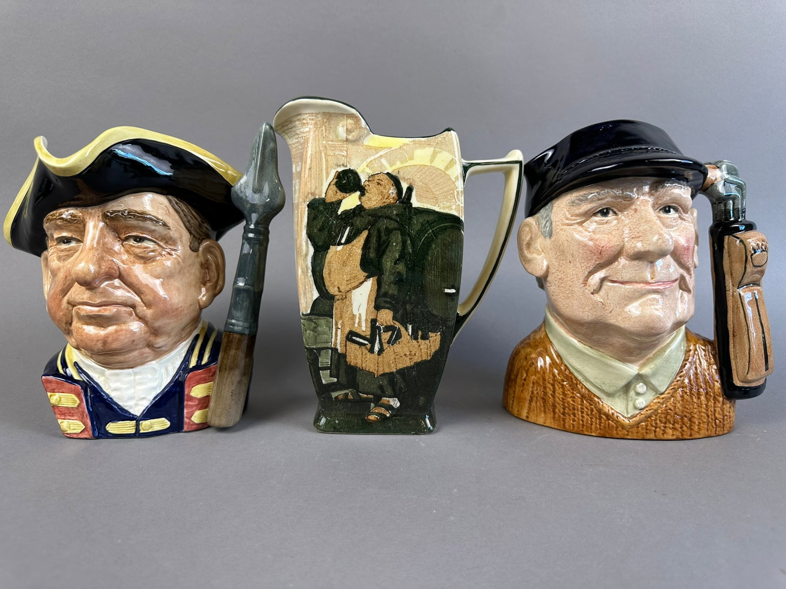 Royal Daulton 3 Piece Lot Monks Cellar Guardman Golfer: Beautiful 3 piece Royal Daulton lot featuring the Guardsman, the Golfer, and the Monks in the Cellar pitcher. Great lot, all pieces in nice condition. Please see pictures for measurements.