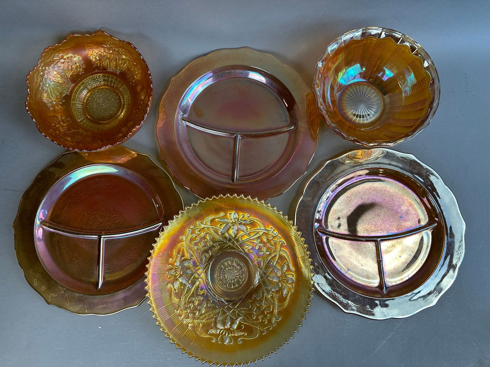 6 Marigold Northwood Millersburg Carnival Glass Lot: This lot consists of 3 matching plates, a northwood bowl, a millersburg ruffled bowl, and another carnival bowl. All pieces are in excellent condition.