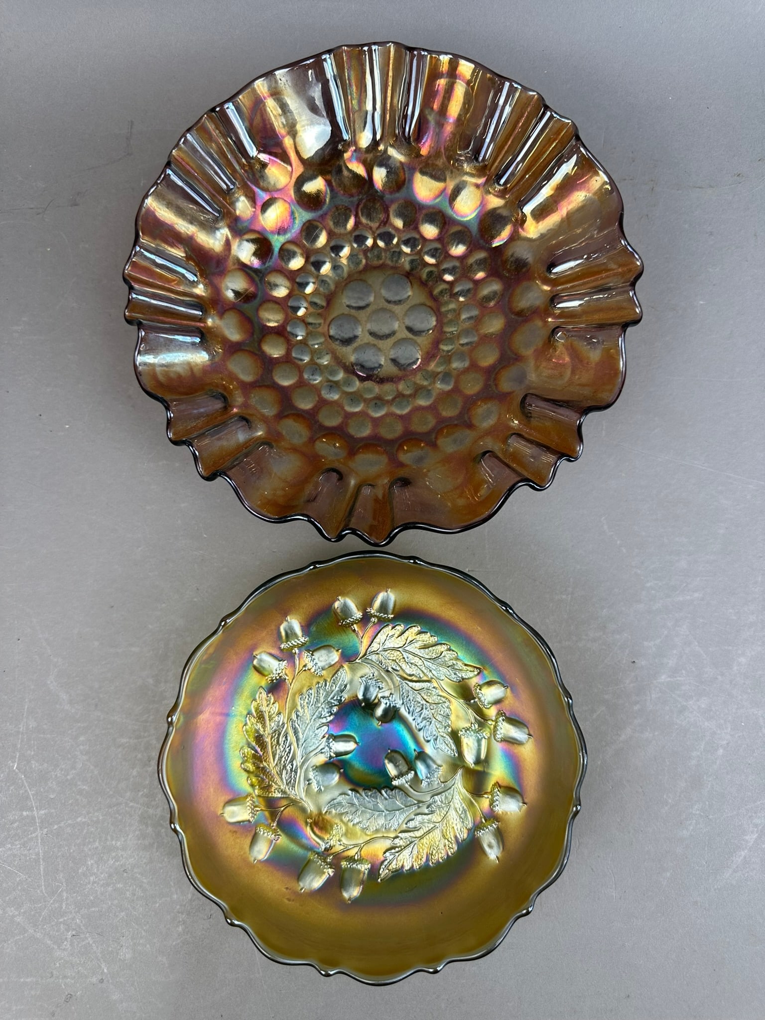 2 Fenton Carnival Glass Bowl Coin Dot Rippled Acorn: This lot consists of 2 Fenton Bowls, one in a beautiful Coin Dot pattern with rippled edge, and the other is Fenton Acorn pattern. Both pieces are in excellent condition.