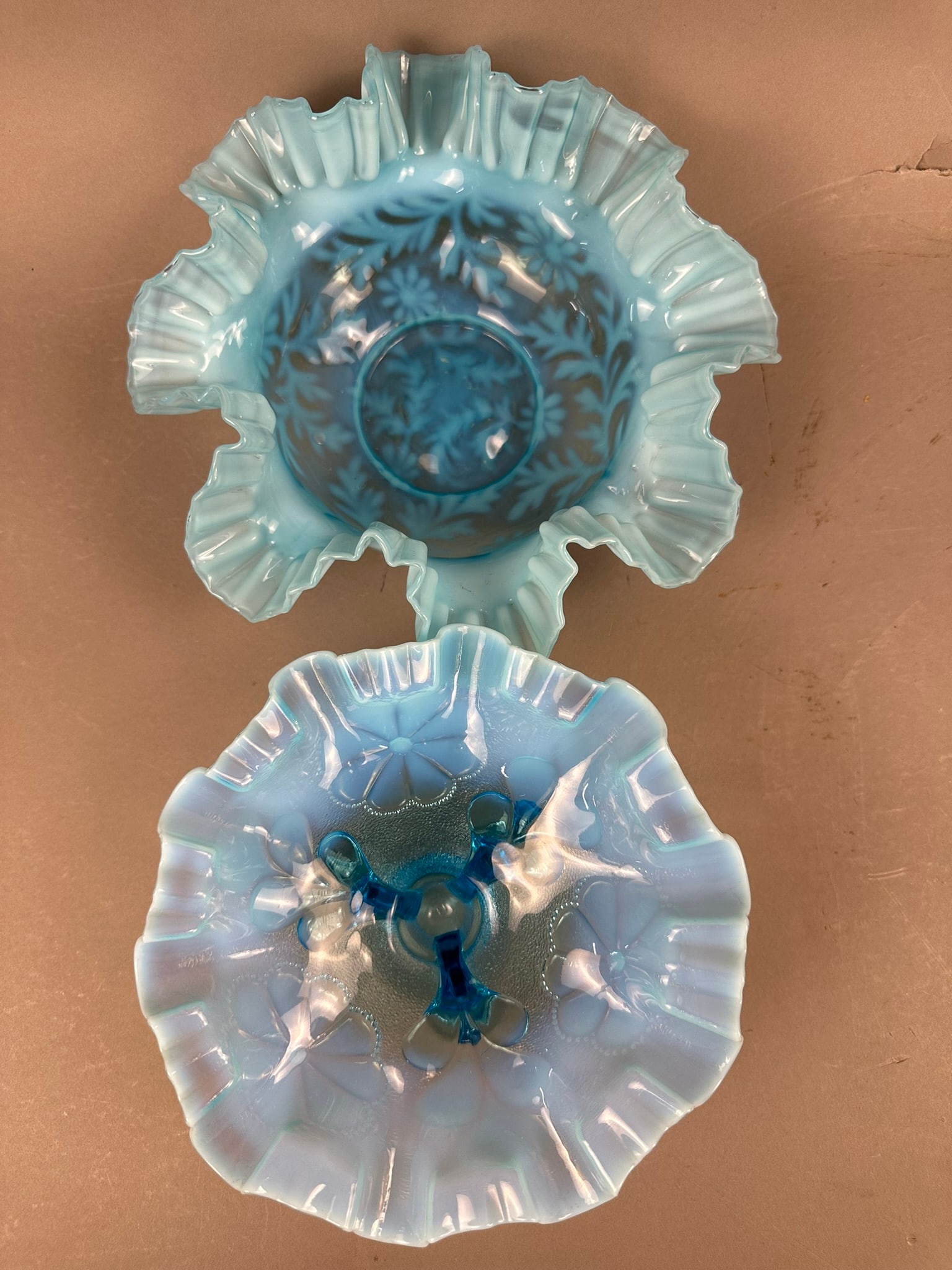 2 Antique Northwood Fenton Blue Opalescent Bowls: This lot features a signed Northwood blue opalescent 3 footed ruffled bowl, the other piece is an unmarked Fenton blue opalescent ruffled bowl with a unique pattern. Both pieces are in excellent condi