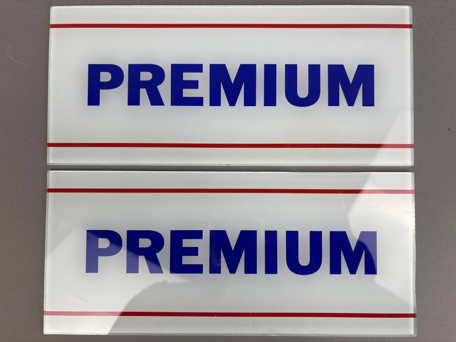 Pair Original Premium Ad Glass Gas Pump Station: This lot contains a pair of original Premium Gasoline ad glass for gas pumps. Overall excellent condition. Overall measurements 10.75"x4.75".