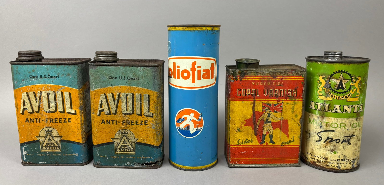 5 European Fiat Avoil Solider Brand Oil Cans: This lot features 5 vintage European brand oil cans, including Fiat, Avoil, Solider Brand, and Talisman. All cans are empty and have condition wear. Please review all pictures for best description.