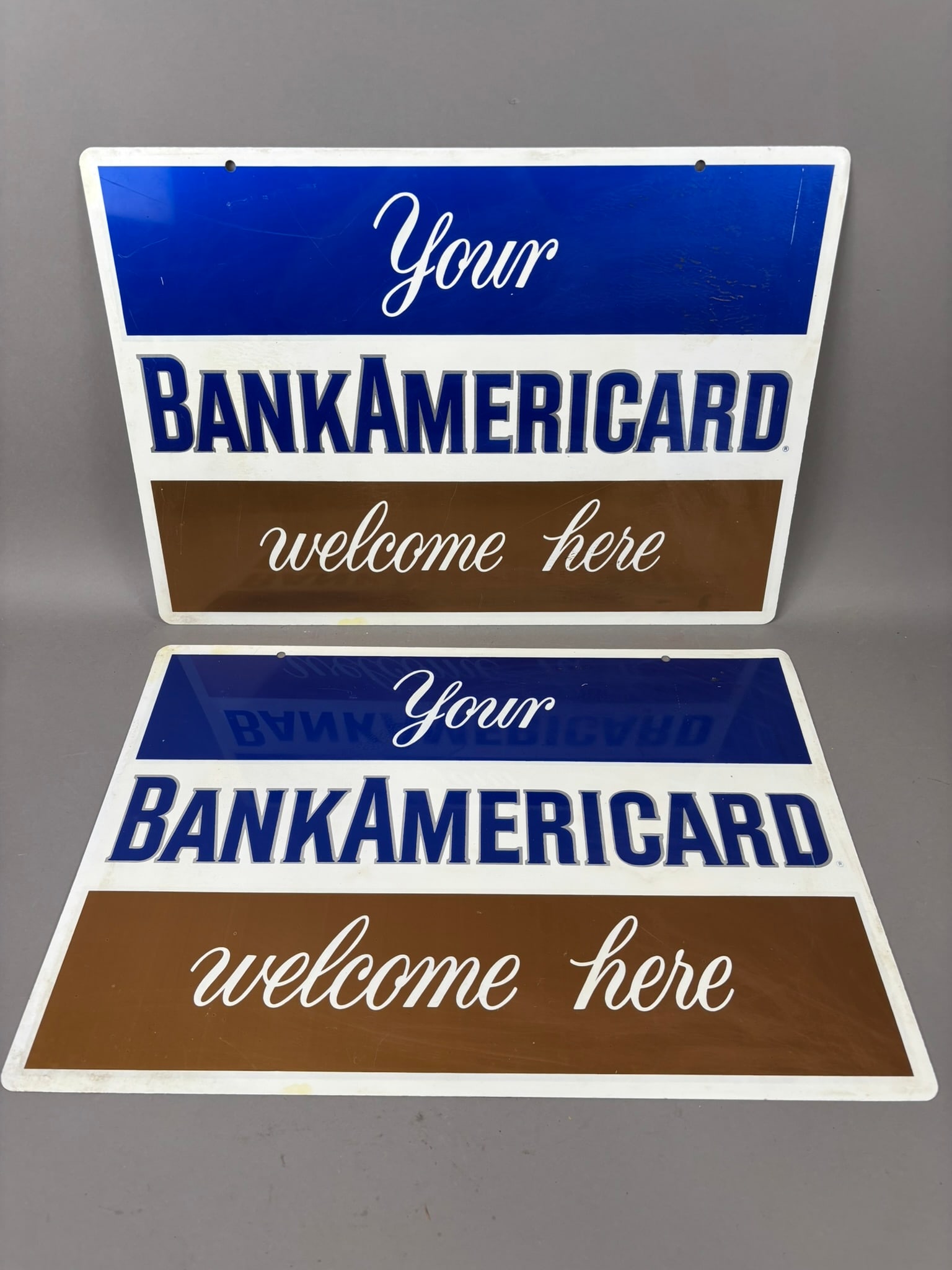 NOS DST BankAmericard Welcome Here Store Sign: This lot features a DST BankAmericard Welcome Here store sign. We removed the original rice paper. Please review all pictures for best decription. Overall measurements are 23"x16".
