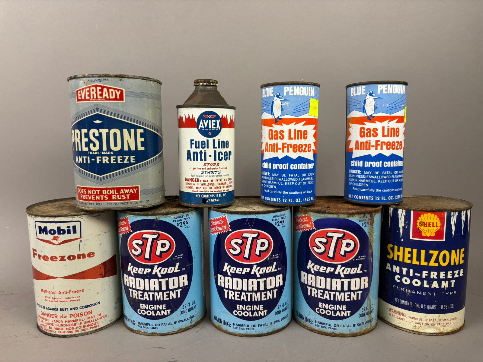 9 NOS Vintage AntiFreeze Mobil STP Shell Quart Cans: This lot features a variety of cans related to radiators and antifreeze. Various brand include Mobil, Shell, STP, and others. Please review all pictures for best description.