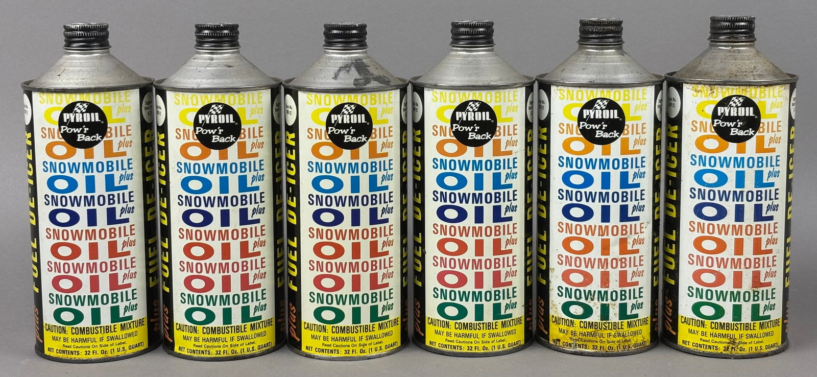 6 60s Pyroil Snowmobile Cone Top Motor Oil Can: This lot features a lot of 6 60s era Pyroil snowmobile motor oil. 1 can is full all others are empty. Please review all pictures for best description.