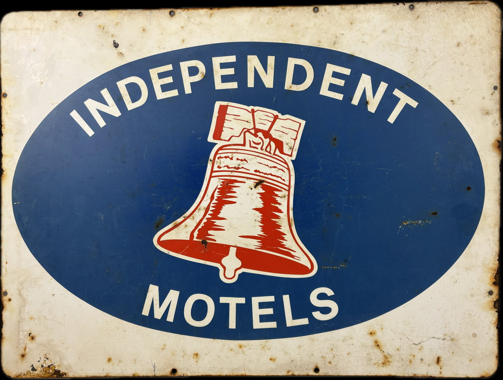Independent Motels DST Advertising Sign Bell Logo: This lot features a double sided painted metal Independent Motels advertising sign. Overall measurements 24"x18". Has some spots of loss and wear, please review all pictures for best description.
