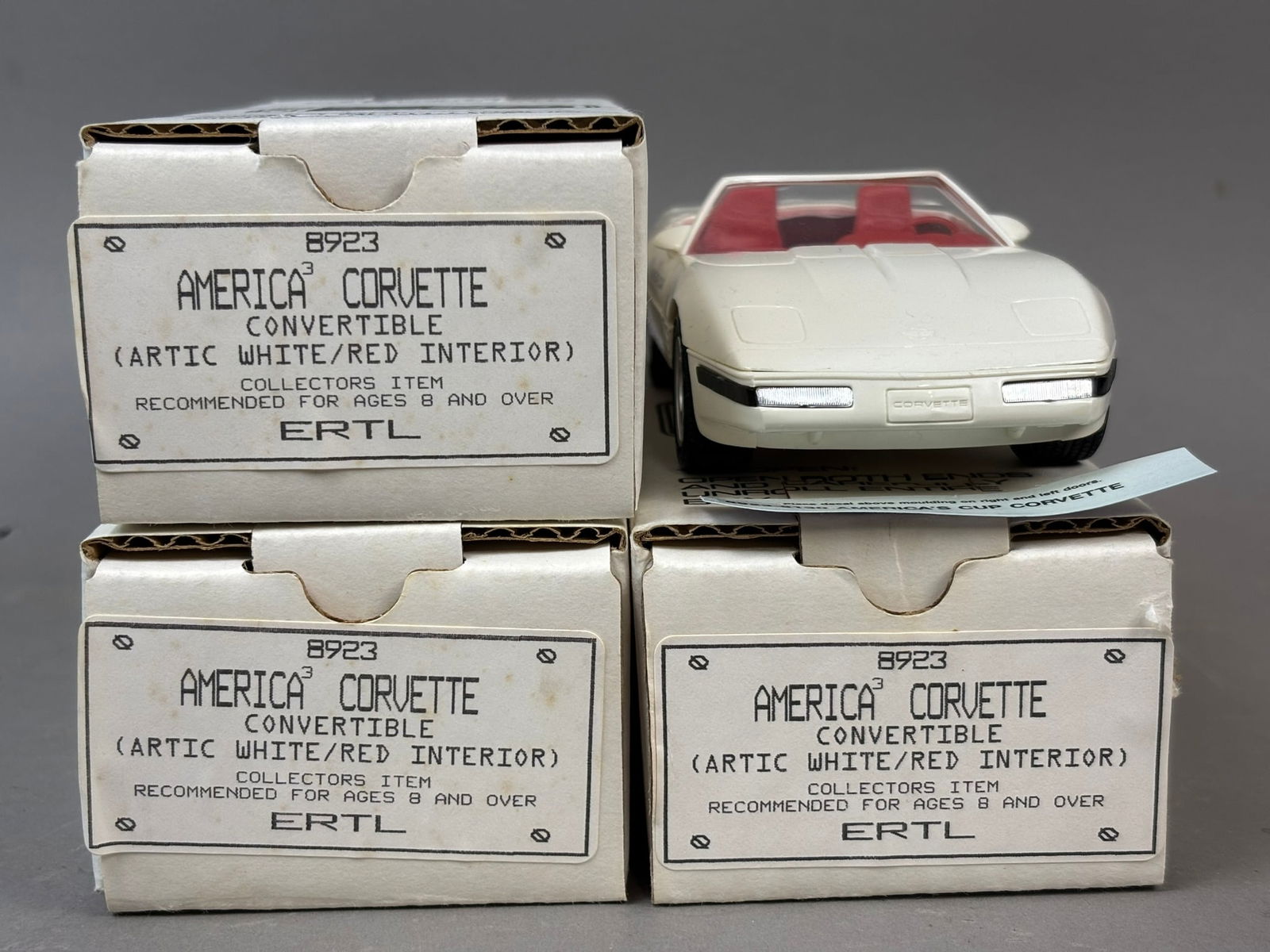 3 NOS Chev Corvette Americas Cup Dealer Promo Cars: This lot features 3 NOS Ertl AMT Chevrolet Corvette advertising for Americas Cup for 1992 San Diego. All toys are in original packaging and like new condition.