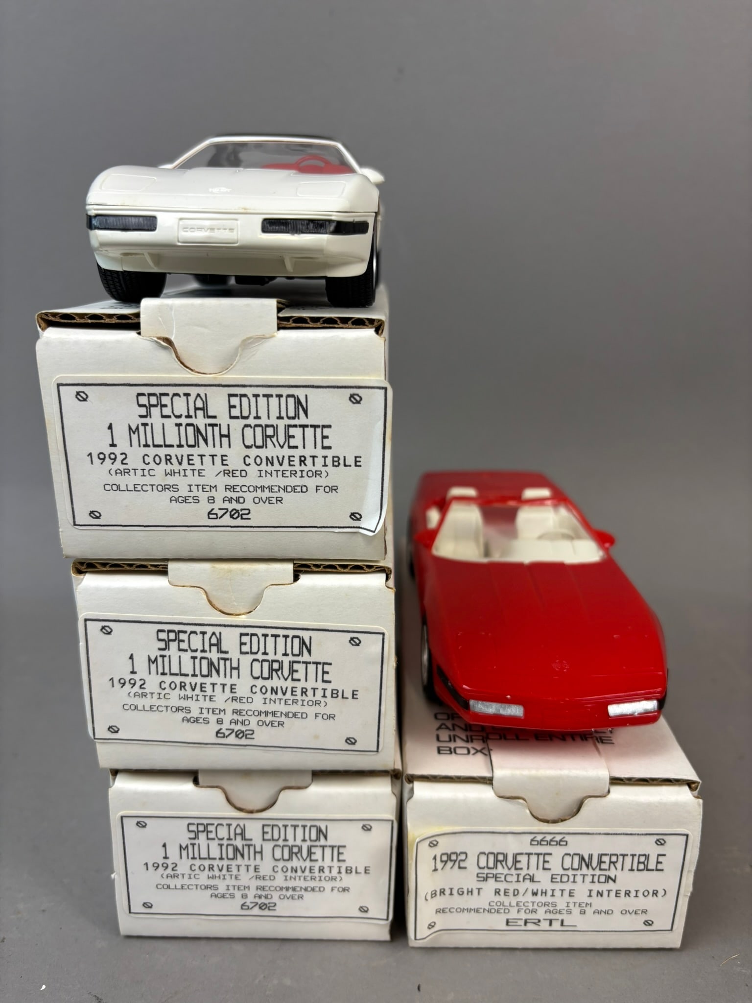 4 NOS Ertl 92 Chev Corvette Million Promo Cars: This lot features 4 NOS Ertl dealer promo cars, all featuring 1992 Chevrolet Corvette models. All toys are in original packaging and in excellent condition.