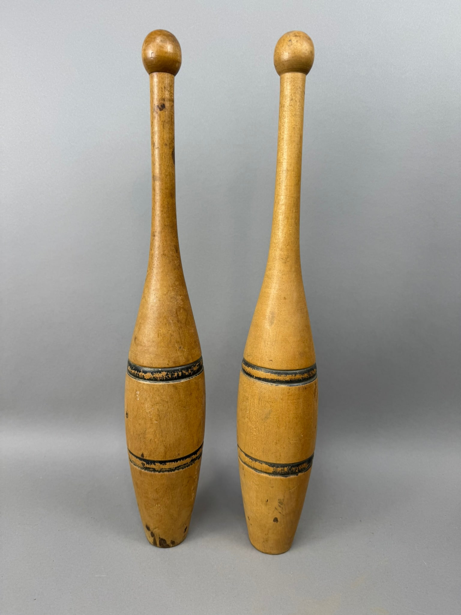 Pair Antique Early 1900s Indian Exercise Carnival Juggling Pins Clubs: Great origianl pair of early 1900s wooden juggling pins. 18" tall roughly.