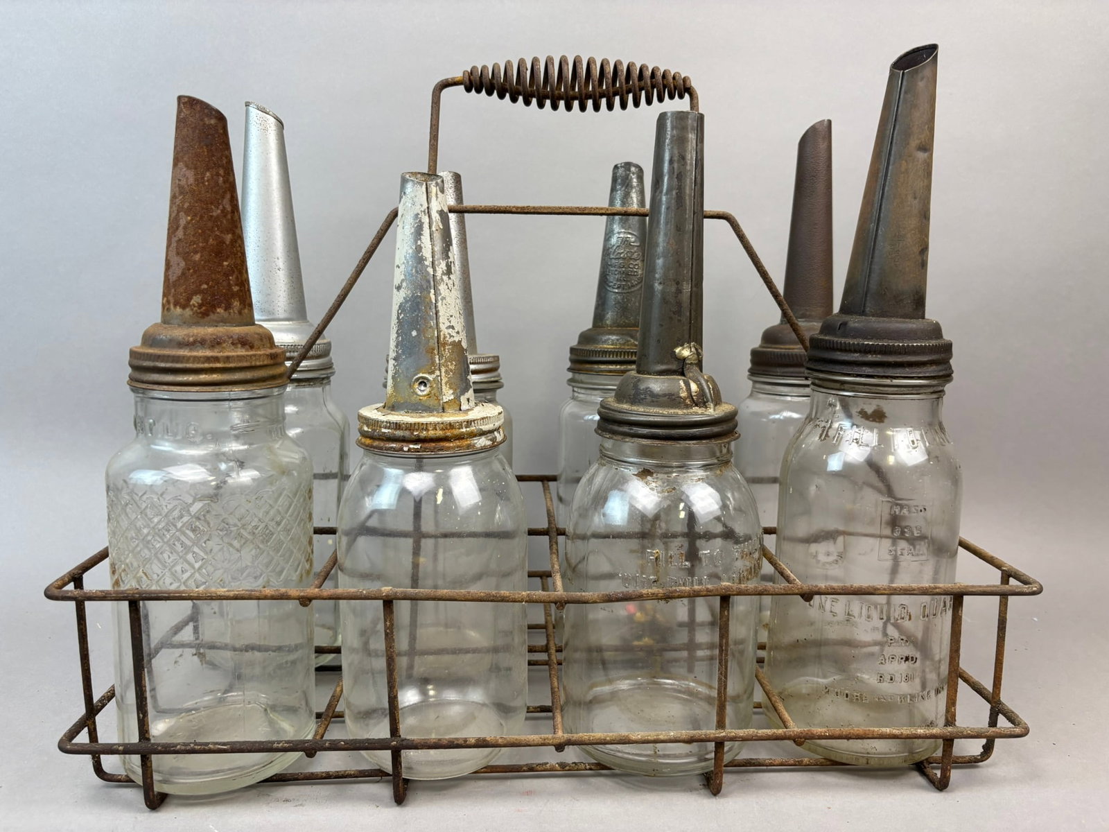 Lot 8 Original Quart Glass Oil Bottles w/ Carrier Masters & Mass Embossed: Great original glass oil bottles and rack. See all photos.
