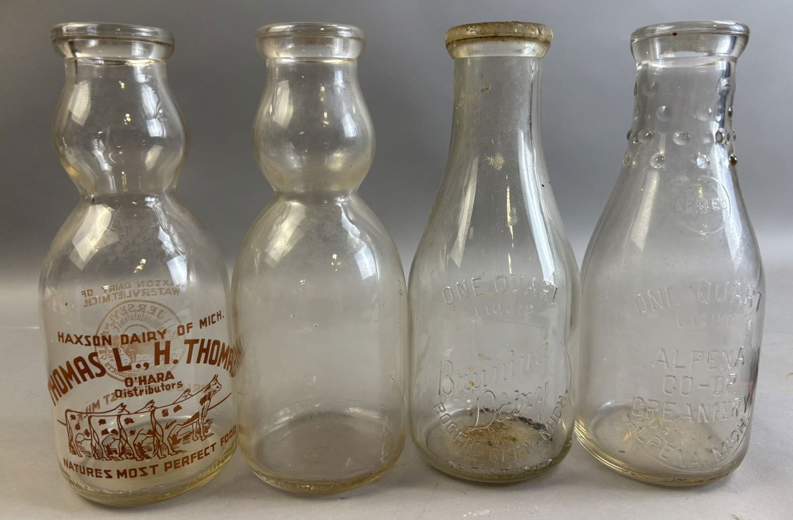 Lot 4 Milk Bottles Haxson Dairy Thomas Bruning Rogers City Alpena CO-OP Creamery (1 of 10)
