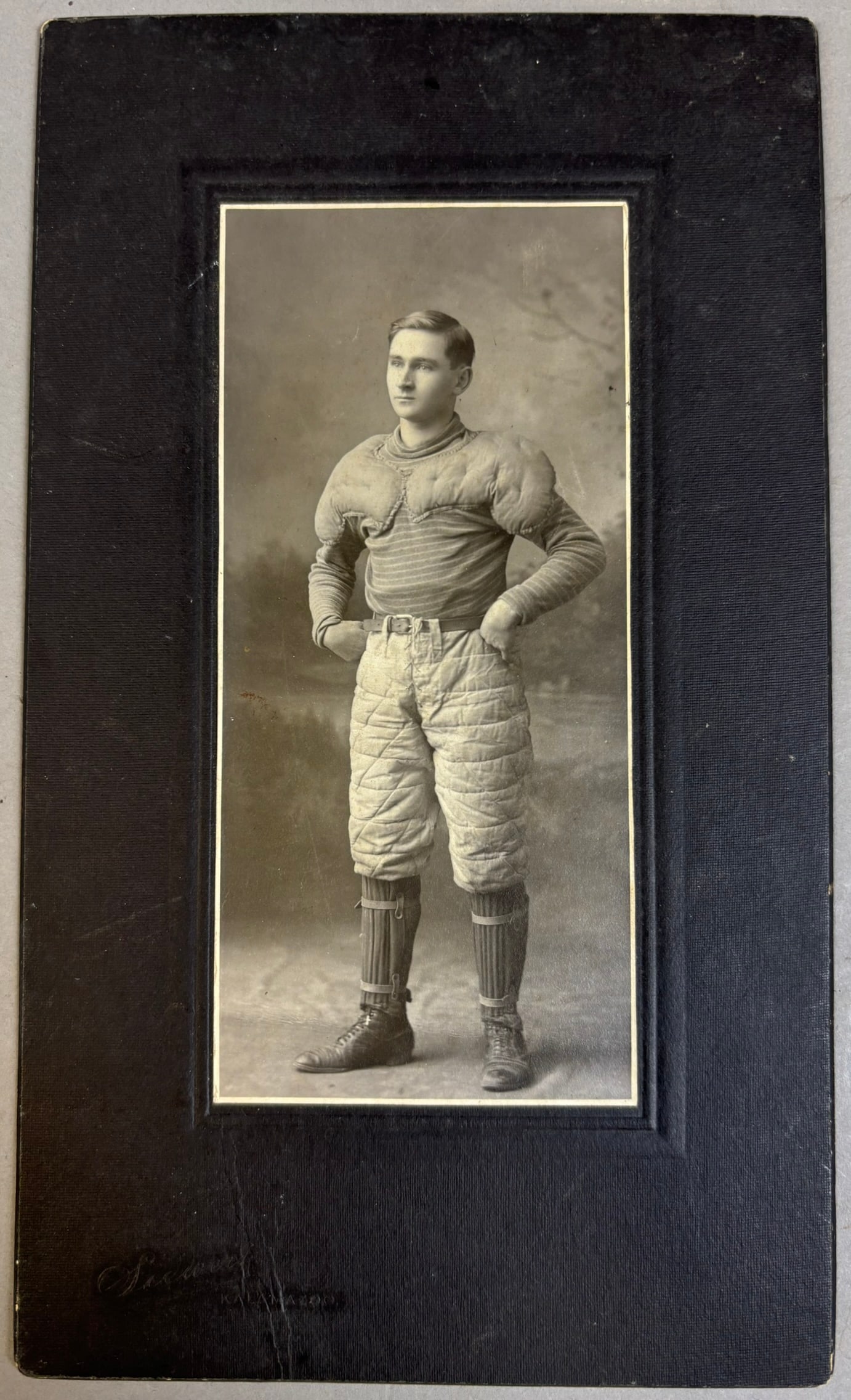Antique Early 1900s Football Player Cabinet Photo w/ Full Quilted Pads: 8.5" x 5" - marked Siewert Kalamazoo PLEASE NOTE WE OFFER IN HOUSE SHIPPING & HAVE BIDDING AVAILABLE ON OUR OWN WEBSITE! If you win on LIVE AUCTIONEERS, please click "SELF ARRANGED SHIPPING" when you