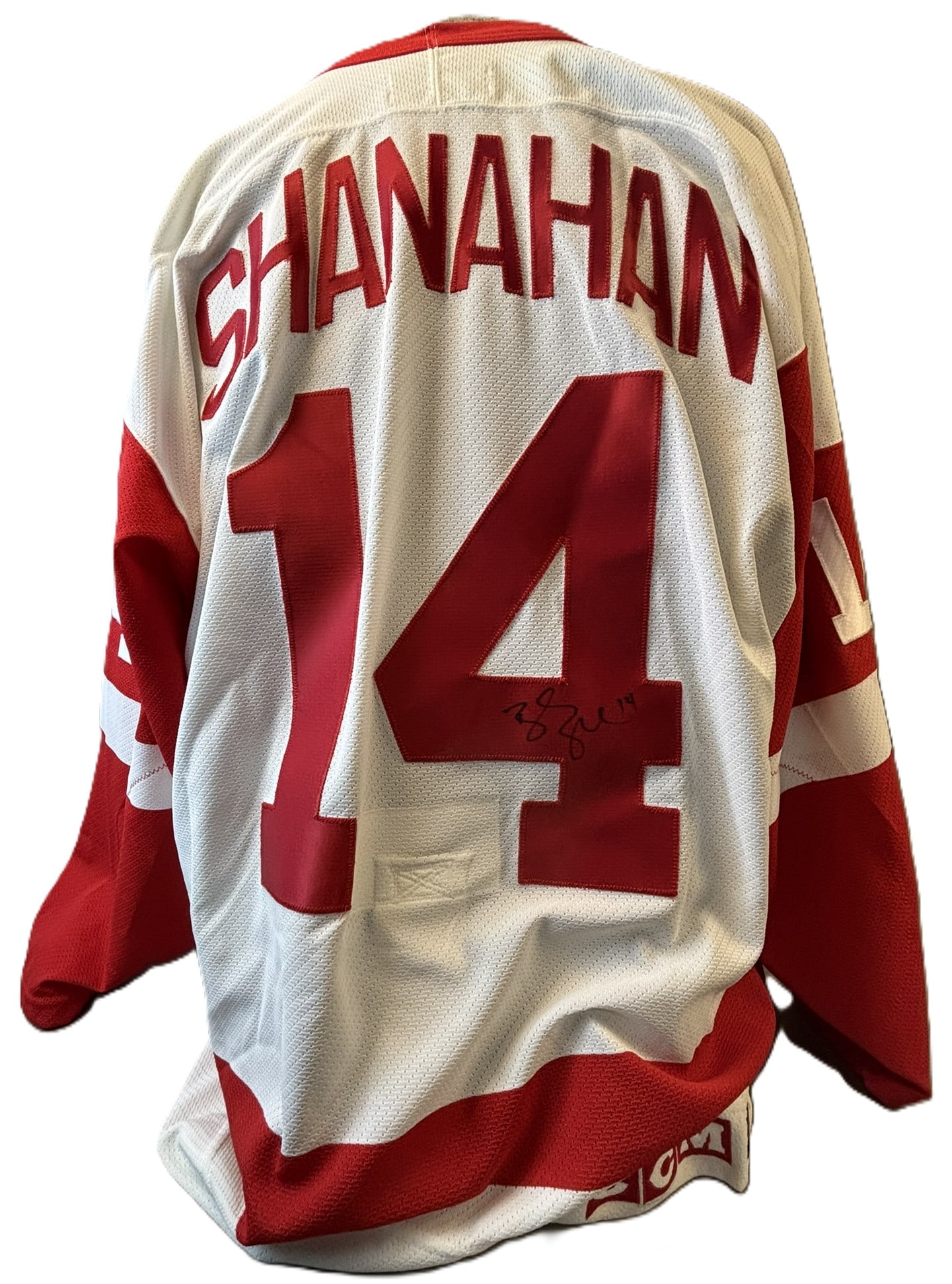 Brendan Shanahan Signed Detroit Red Wings CCM Jersey #14: Offered here is a Brendan Shanahan autographed Detroit Red Wings CCM jersey featuring the iconic number 14.This white Red Wings road-style jersey displays bold red tackle-twill lettering spelling R