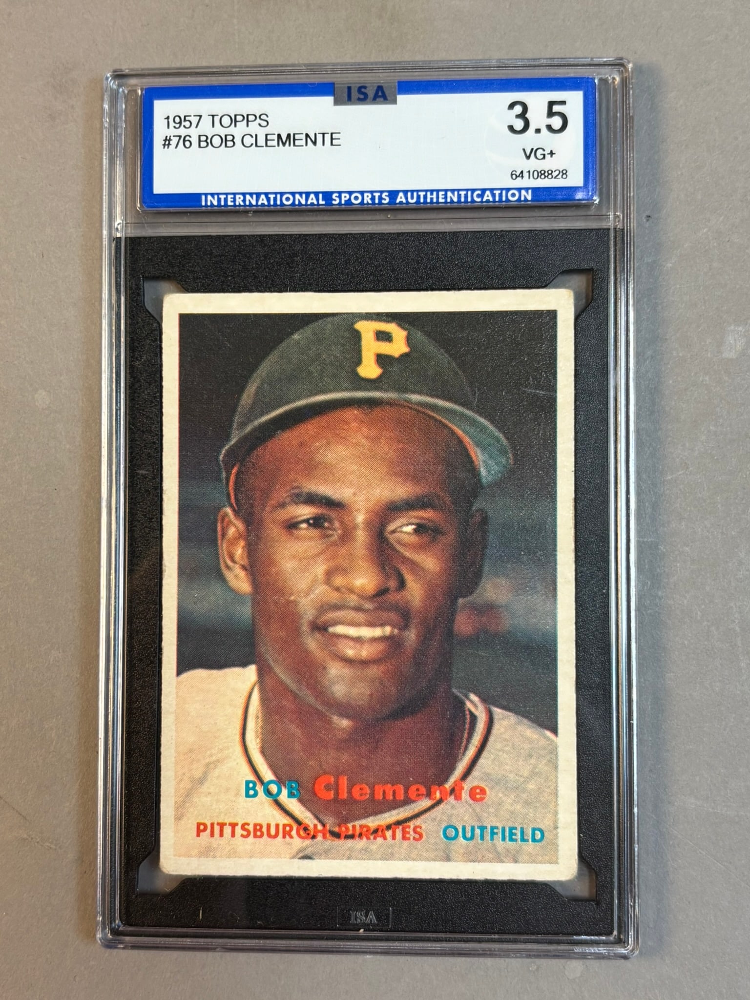 1957 Topps #76 Bob Clemente HOF ISA 3.5 VG+ Very Good: ISA 3.5 Cert 64108828 PLEASE NOTE WE OFFER IN HOUSE SHIPPING & HAVE BIDDING AVAILABLE ON OUR OWN WEBSITE! If you win on LIVE AUCTIONEERS, please click "SELF ARRANGED SHIPPING" when you receive your in