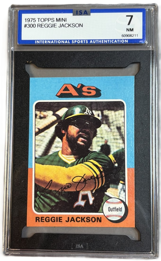 1975 Topps Mini #300 Reggie Jackson HOF ISA 7 NM Near Mint: ISA GRADED 7 Cert #60908211 PLEASE NOTE WE OFFER IN HOUSE SHIPPING & HAVE BIDDING AVAILABLE ON OUR OWN WEBSITE! If you win on LIVE AUCTIONEERS, please click "SELF ARRANGED SHIPPING" when you receive y
