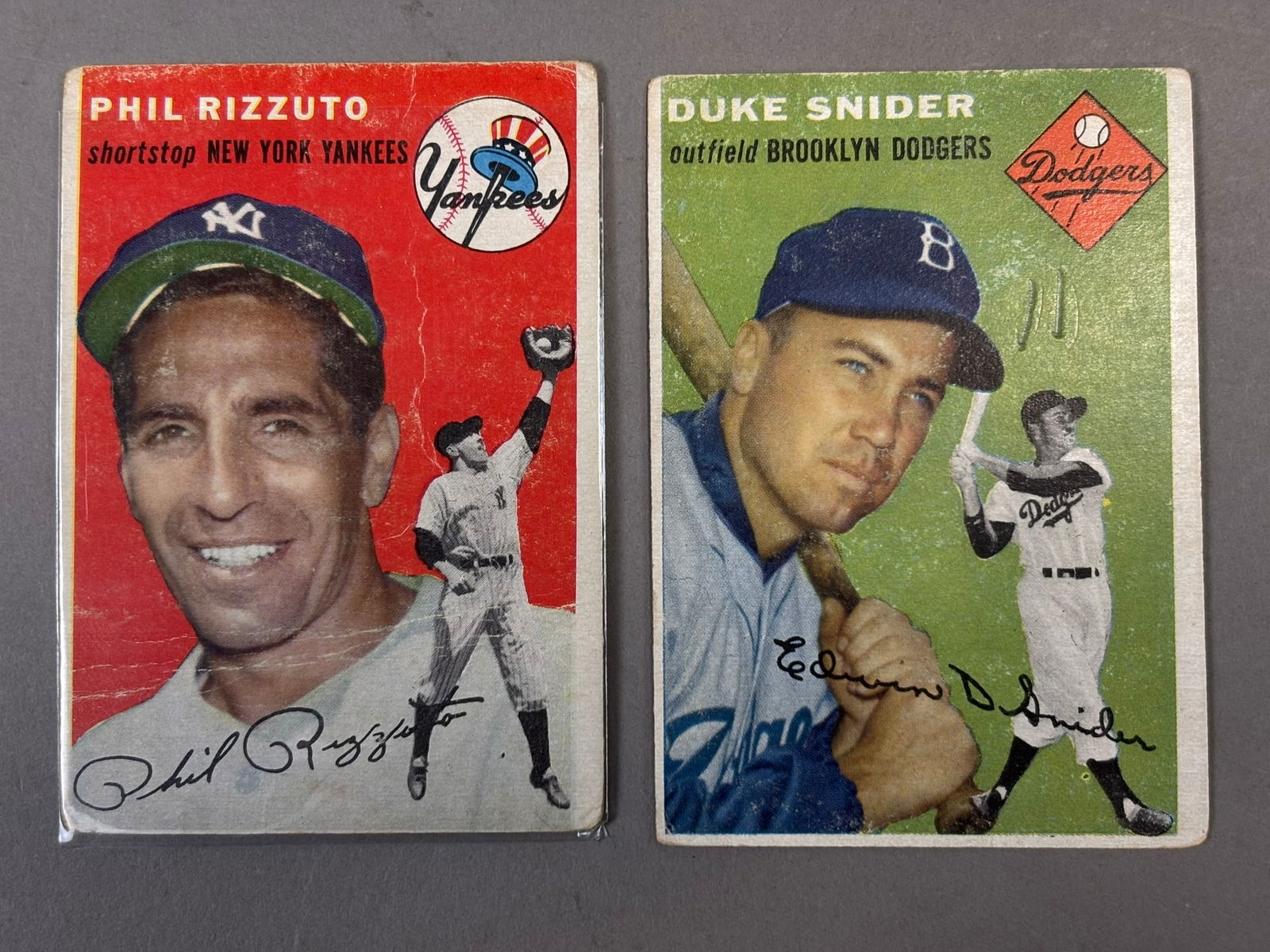Pair 1954 Topps Phil Rizzuto #17 & Duke Snider #32 HOF Baseball Cards: 1954 pair of worn hofers as shown. Snider has pencil. PLEASE NOTE WE OFFER IN HOUSE SHIPPING & HAVE BIDDING AVAILABLE ON OUR OWN WEBSITE! If you win on LIVE AUCTIONEERS, please click "SELF ARRANGED SH