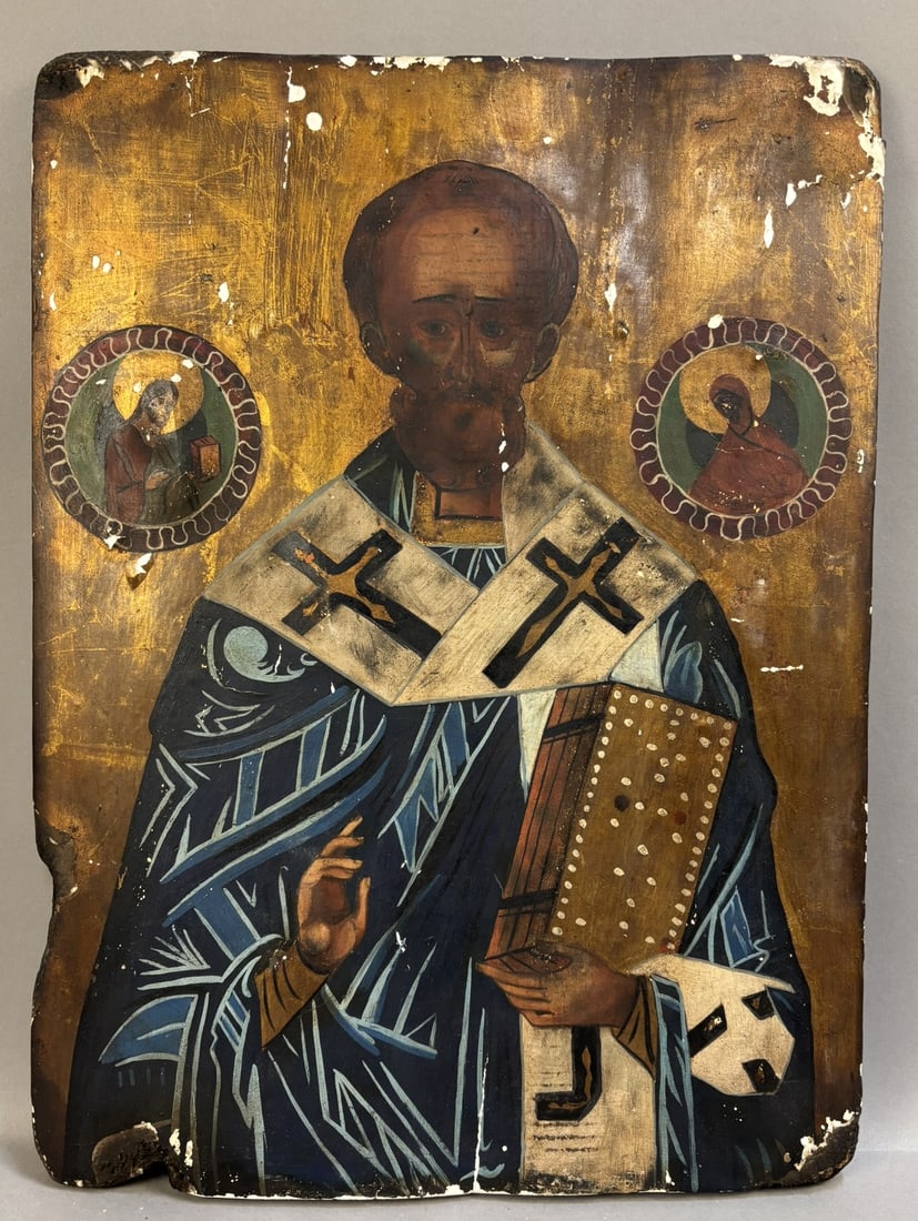 Antique 19th Century Eastern Orthodox Religious Icon on Wood Panel 16.5 x 22: Antique hand-painted Eastern Orthodox icon on wooden panel, measuring approximately 16.5 x 22 inches. The icon depicts a haloed bishop saint—likely St. Nicholas—robed in traditional episcopal vest