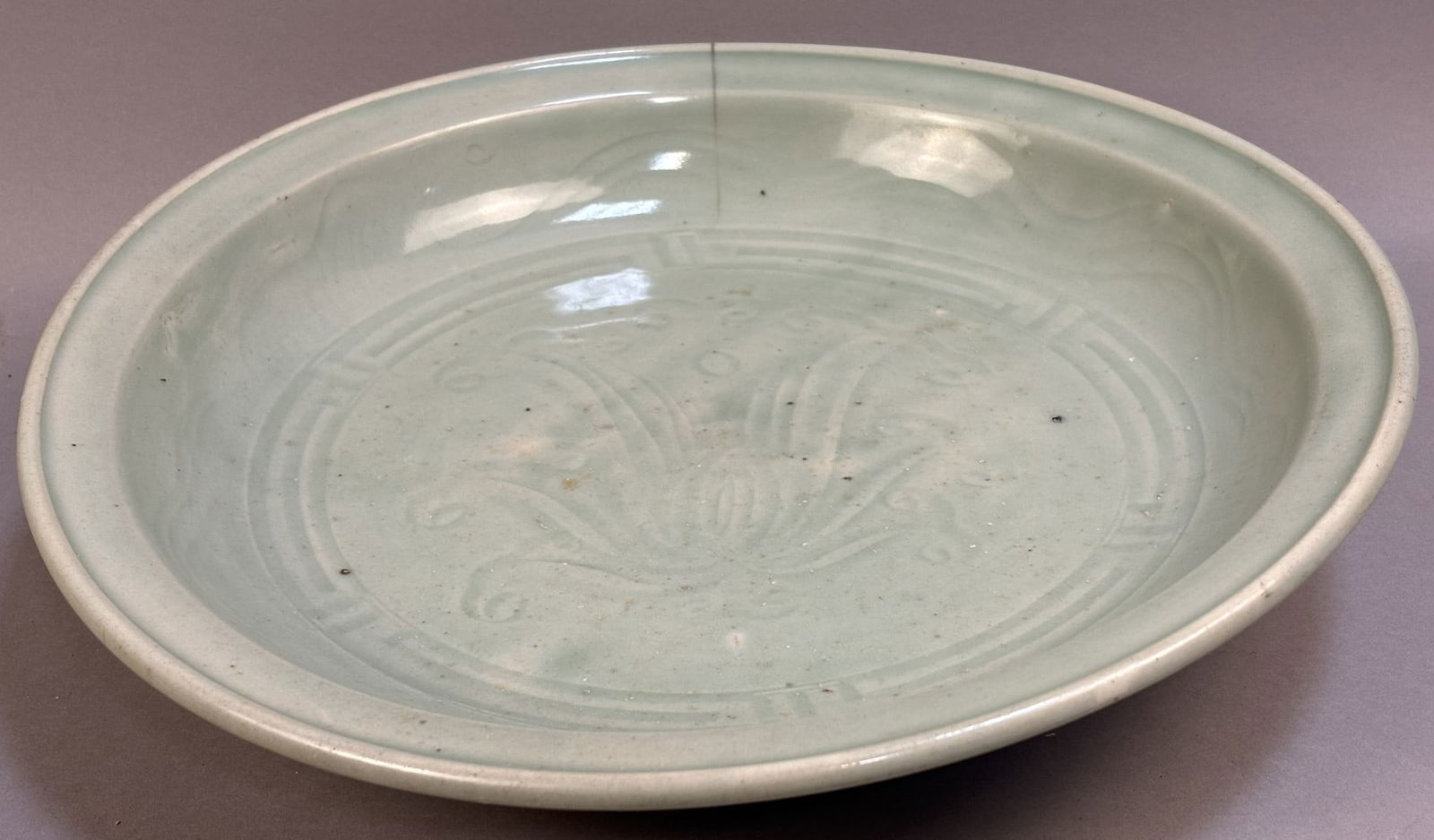 Art Deco Celadon Glazed Pottery Bowl 14" Floral Relief Design: A handsome Art Deco period pottery bowl featuring a soft celadon glaze and subtle raised floral relief decoration to the interior. Measuring approximately 14" in diameter and 3" in height, this piece