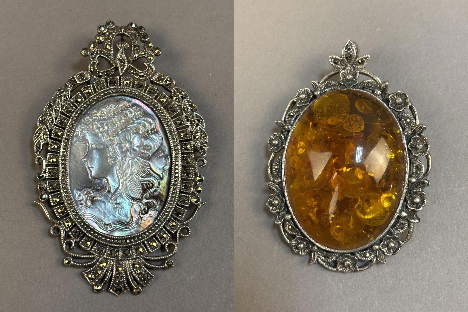 Art Nouveau Sterling Marcasite Mother of Pearl Cameo & Amber Brooch: Two decorative silver brooches including an Art Nouveau style brooch set with marcasite surrounding an iridescent carved mother-of-pearl cameo depicting a classical female profile, together with a bro