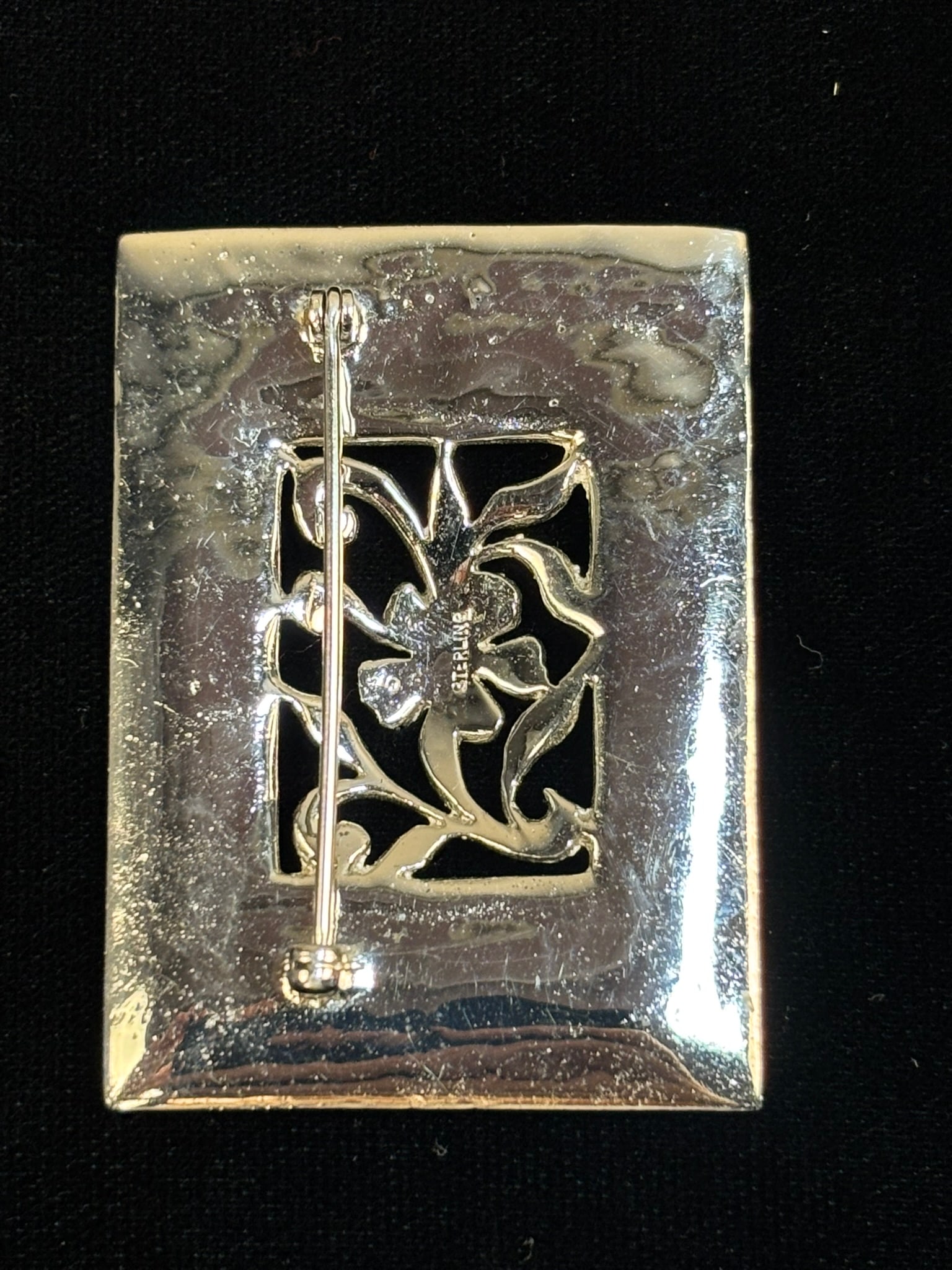 Art Nouveau Sterling Marcasite Floral Openwork Brooch 17.9 Grams: Art Nouveau style sterling silver brooch featuring an ornate rectangular openwork design set throughout with marcasite stones. The center panel displays a flowing floral motif surrounded by radiating