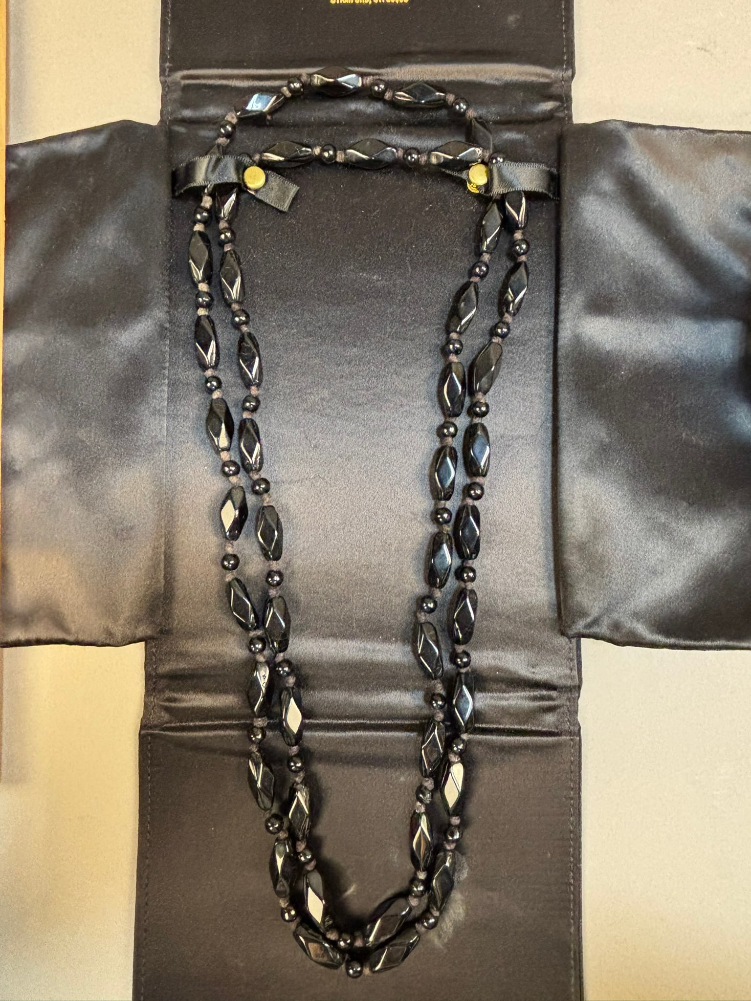 Jose Grant Black Onyx Bead Necklace Double Strand w Case: Black bead necklace attributed to Jose Grant, Inc. presented in its original satin jewelry travel case labeled “Jewelry by Jose Grant, Inc., Stamford, CT.” The necklace features a double s