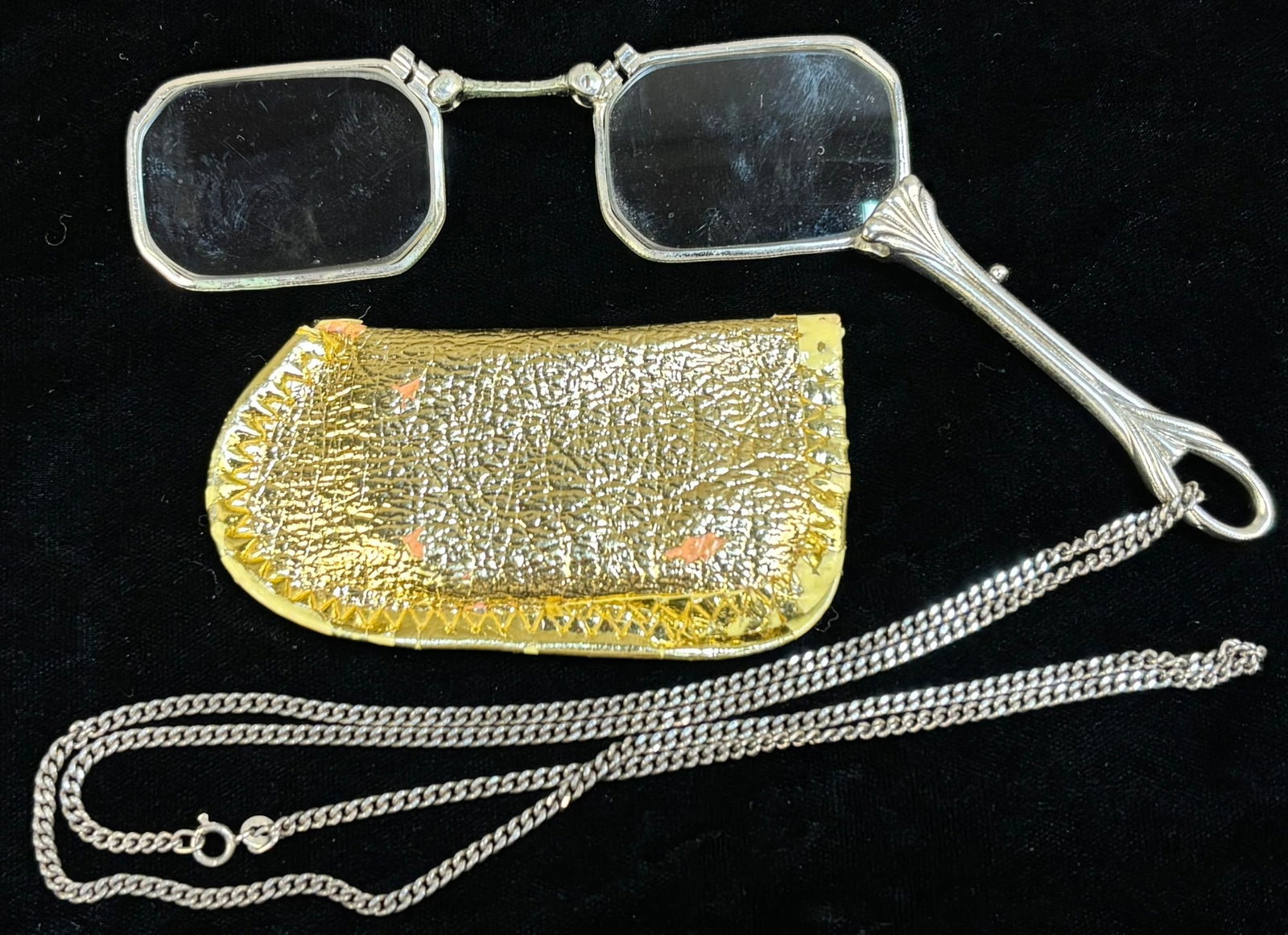 German 835 Silver Folding Lorgnette Glasses w Chain & Gilt Case 38.1g: German-made folding lorgnette spectacles marked “Made in Germany 835”, crafted in 83.5% silver and accompanied by their original silver chain and a small gilt eyeglass case. The lorgnette