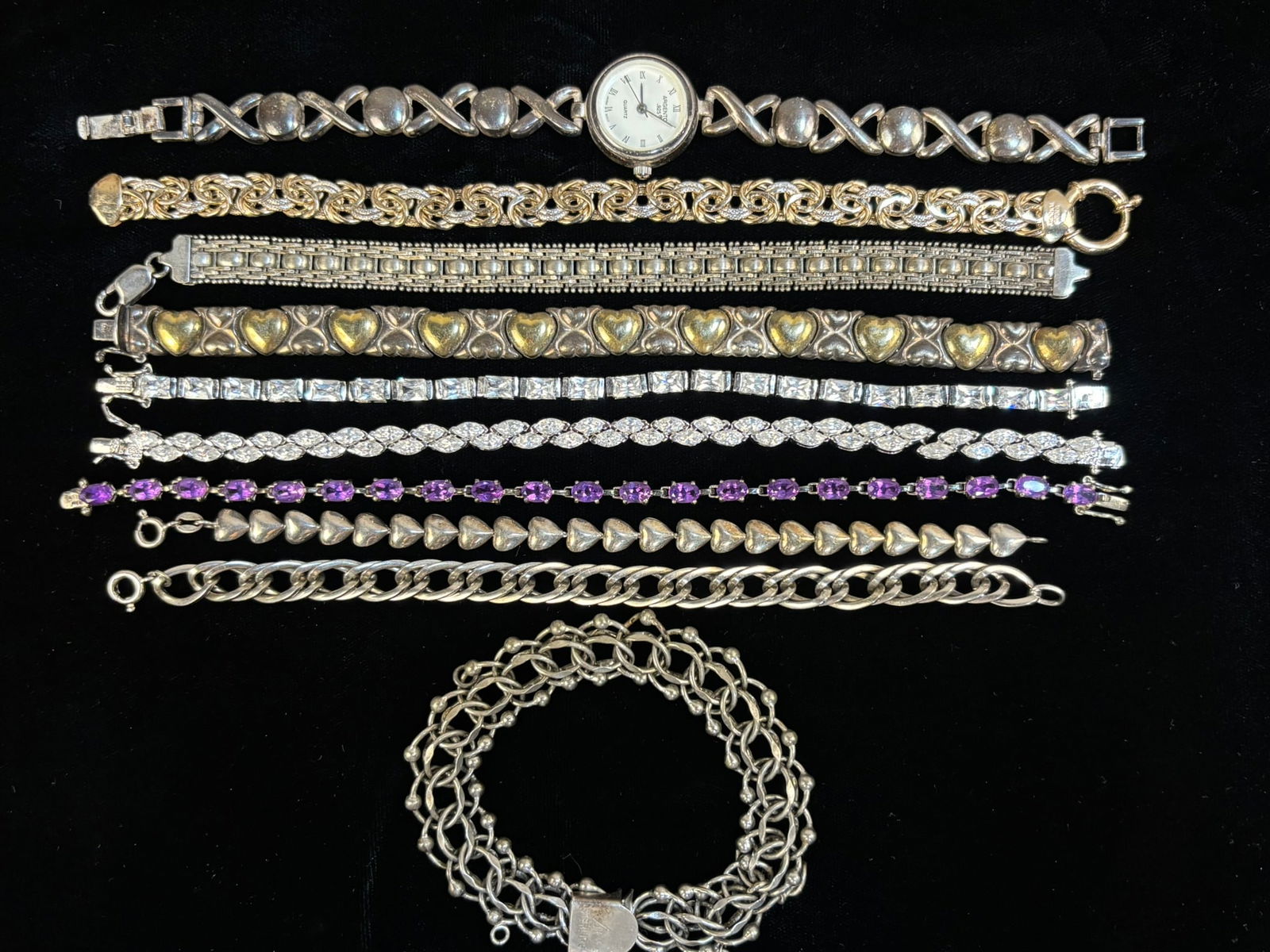 Mixed Sterling Silver Bracelets Lot Argento 925 Watch Amethyst CZ 10pc 162 Grams: Collection lot of ten vintage sterling silver bracelets and a sterling wristwatch, including a ladies Argento .925 quartz watch with Japan movement, multiple sterling link bracelets, heart motif brace