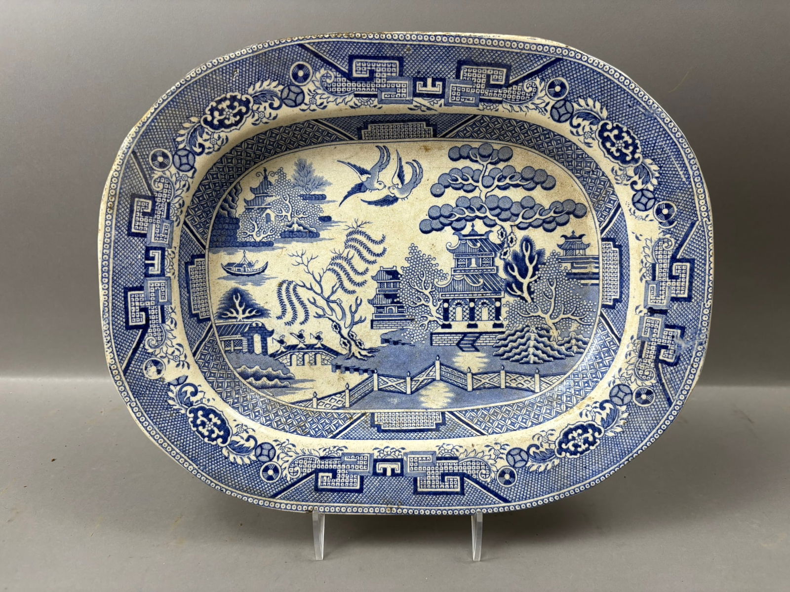 Antique Blue White Transferware Chinese Pagoda Oval Platter 13.5": Antique 19th century blue and white transferware oval serving platter featuring a classic chinoiserie landscape scene with pagodas, stylized trees, a bridge with figures, water scene with boat, and bi