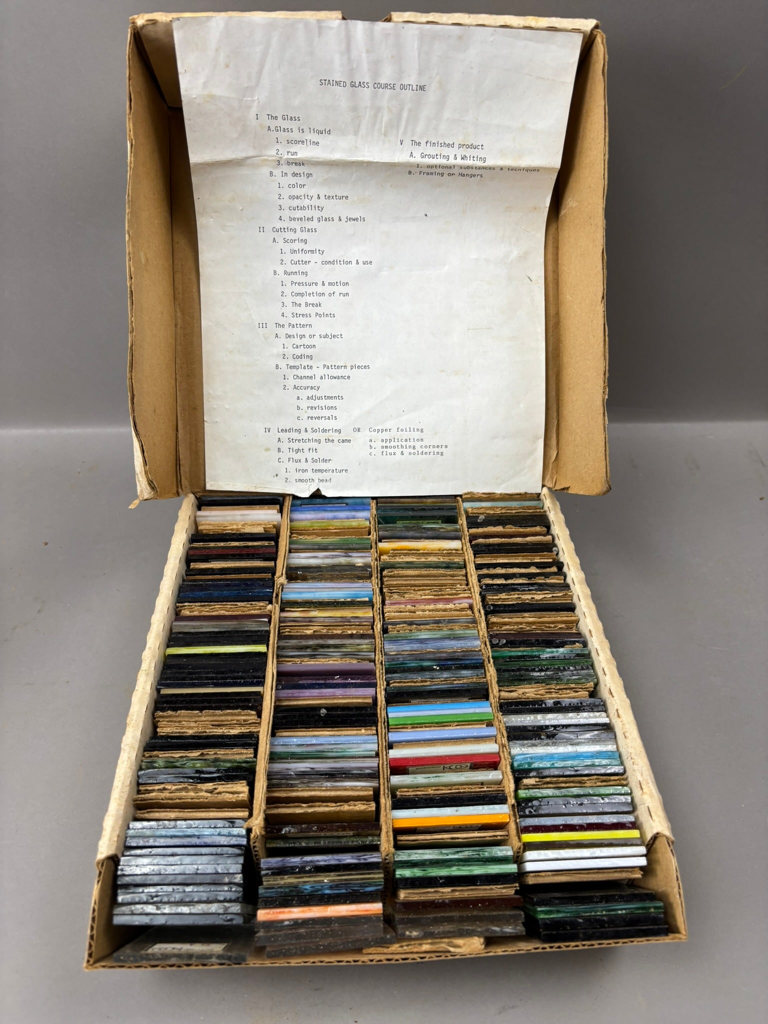 Kokomo Opalescent Glass Sample Kit w Course Outline Approx 200 Pieces: Kokomo Opalescent Glass Company stained glass sample kit containing approximately 200 small glass pieces arranged in compartment trays within the original cardboard box labeled Kokomo Opalescent