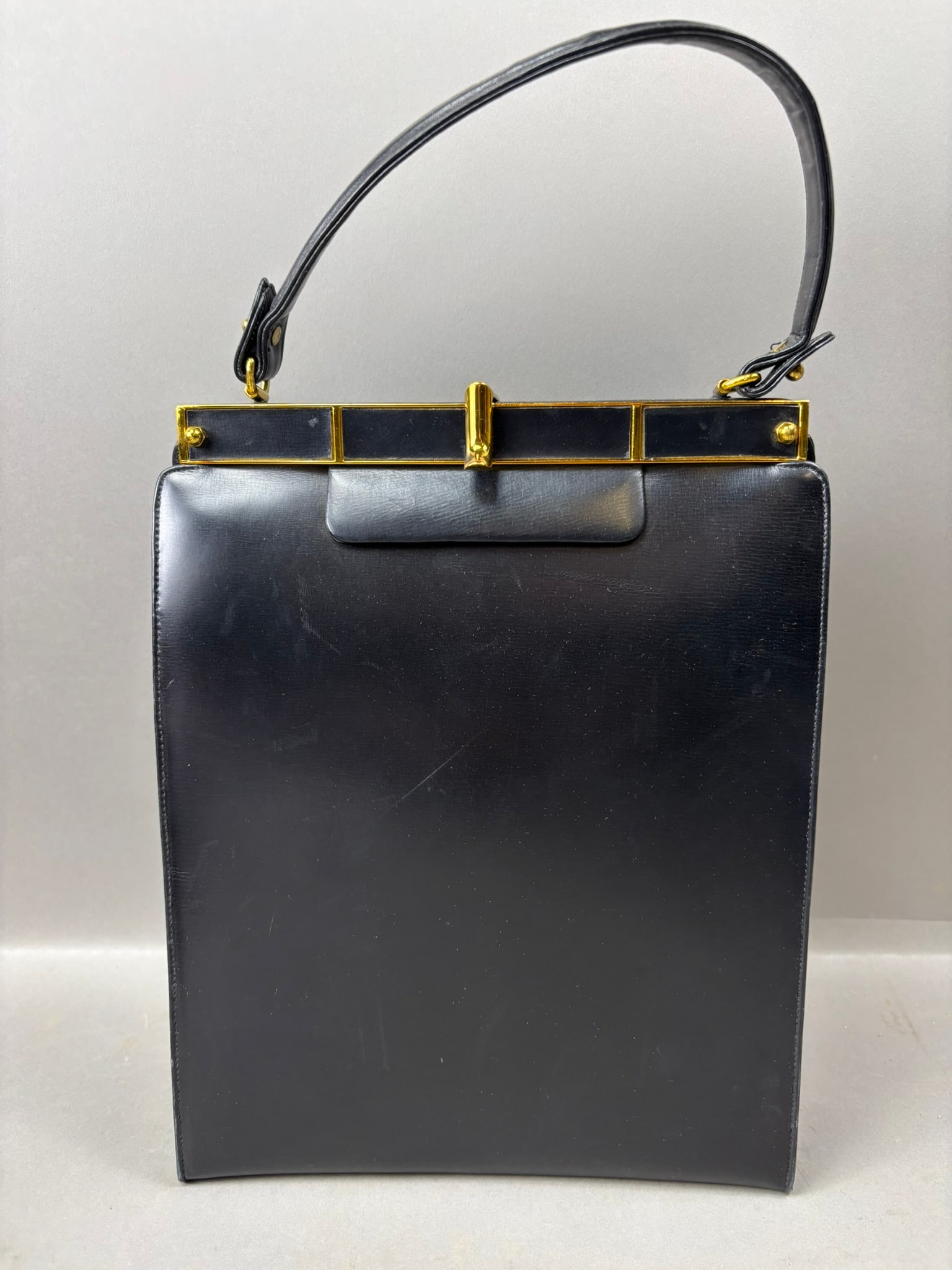 Vintage Artcrafts Black Leather Handbag w Red Interior & Coin Purse: Vintage Artcrafts black leather handbag featuring a tall structured rectangular form with gold tone frame and clasp hardware, black leather handle, and a vibrant red leather interior. The bag includes