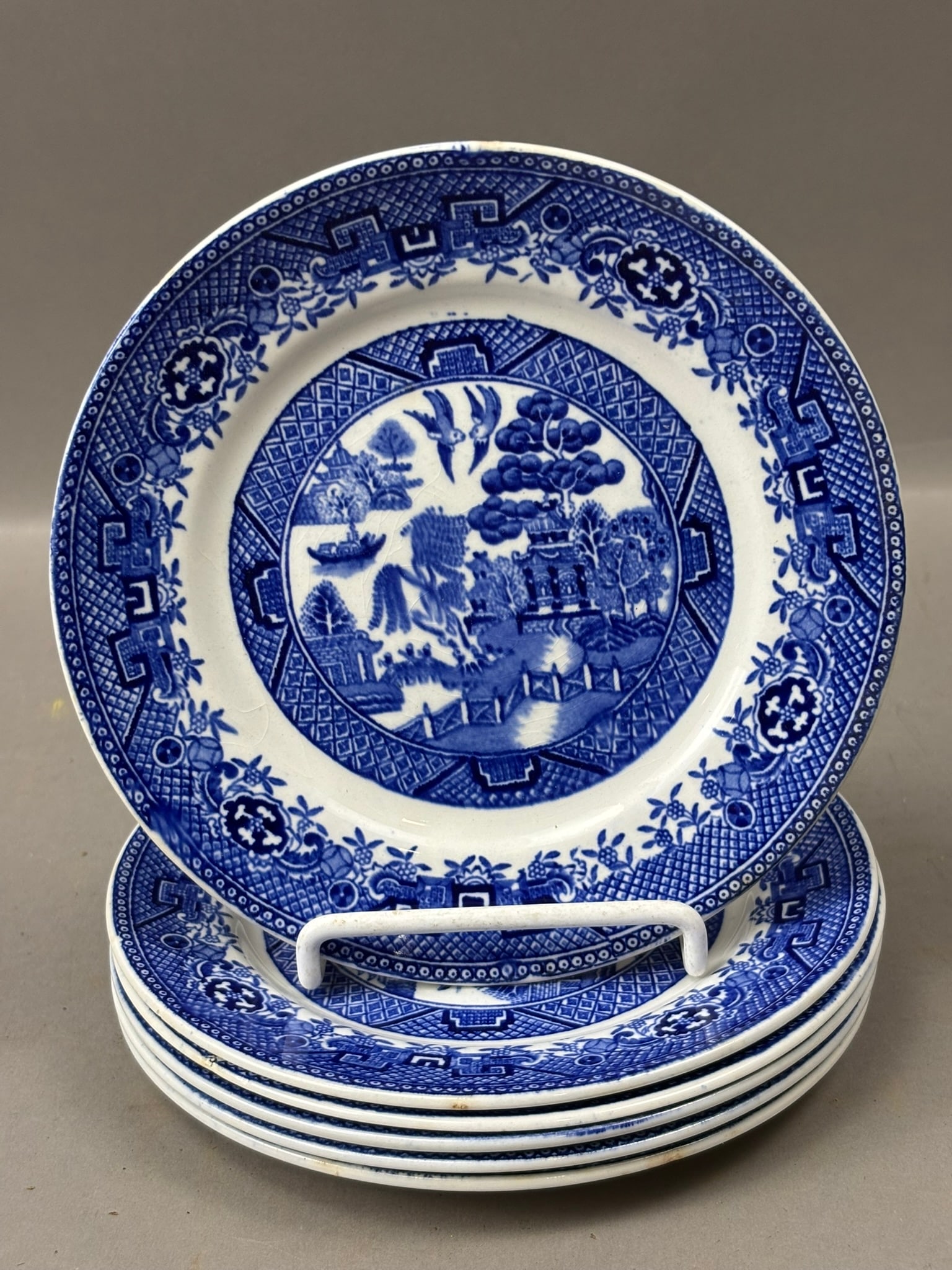 Set of 6 19th Century Staffordshire Flow Blue “Willow” Pattern Plates 6”: Attractive set of six antique English flow blue plates in the classic “Willow” pattern, each measuring approximately 6 inches in diameter and marked on the underside “Warranted Staff