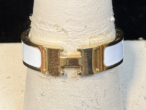 Hermès 18K Gold White Enamel H Band Ring Size 10 AU750 4.27g: Authentic Hermès designer ring crafted in solid 18K yellow gold (marked AU750) featuring the iconic H motif flab4323ed by glossy white enamel panels, a classic luxury design associated with the H