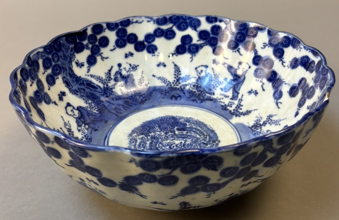 Chinese Qing Blue & White Porcelain Boys at Play Bowl Guangxu Period: Chinese blue and white porcelain bowl decorated with boys at play beneath a flowering prunus border and centered with a phoenix medallion. Hand painted underglaze cobalt decoration typical of late Qin