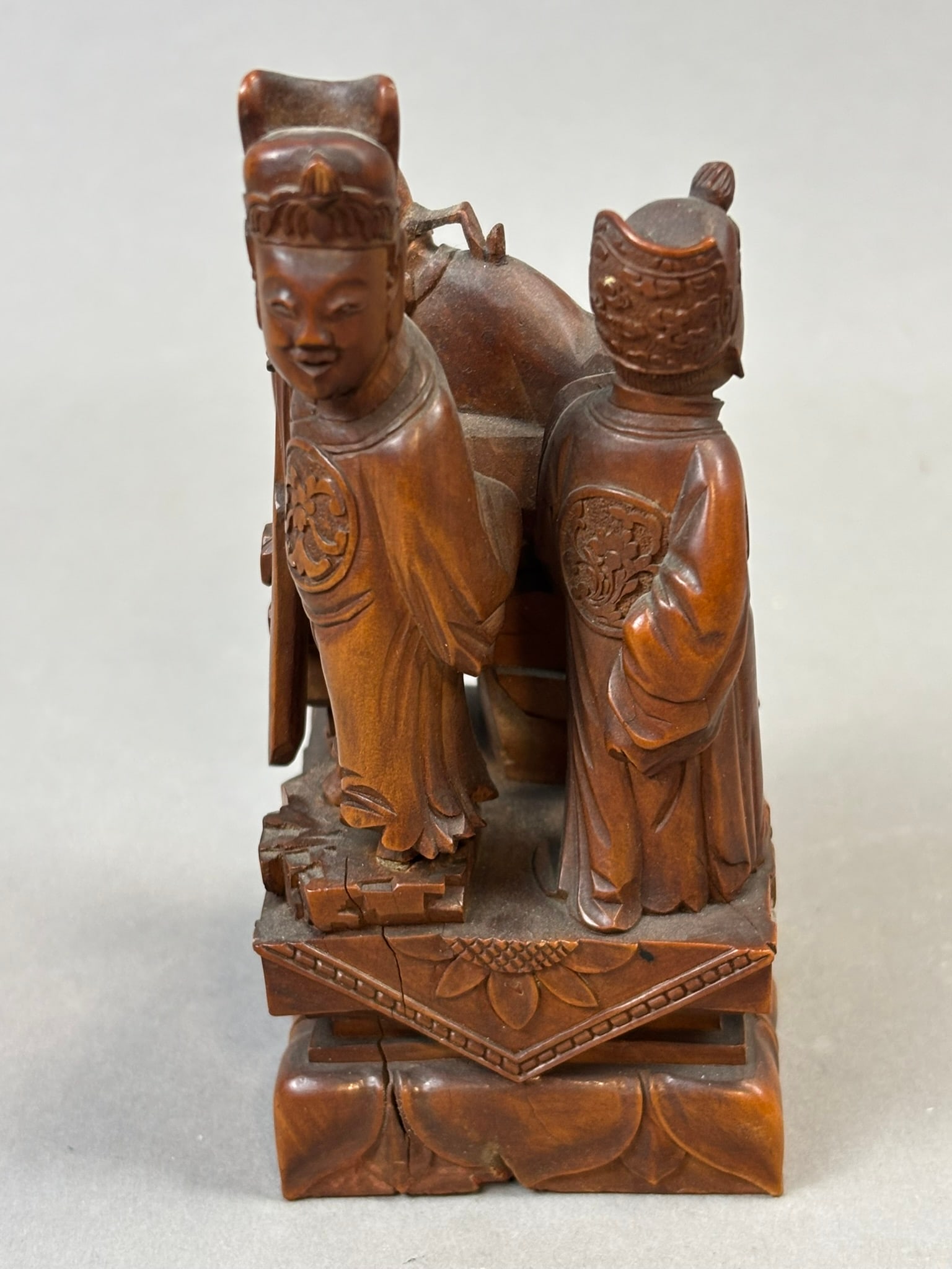Chinese Carved Wood Figural Group w/ Seal Mark Base 4.5" Tall: Chinese carved wood figural sculpture depicting a three-figure group in traditional robes, likely representing immortals or scholarly court figures gathered around a table or stand. The composition in