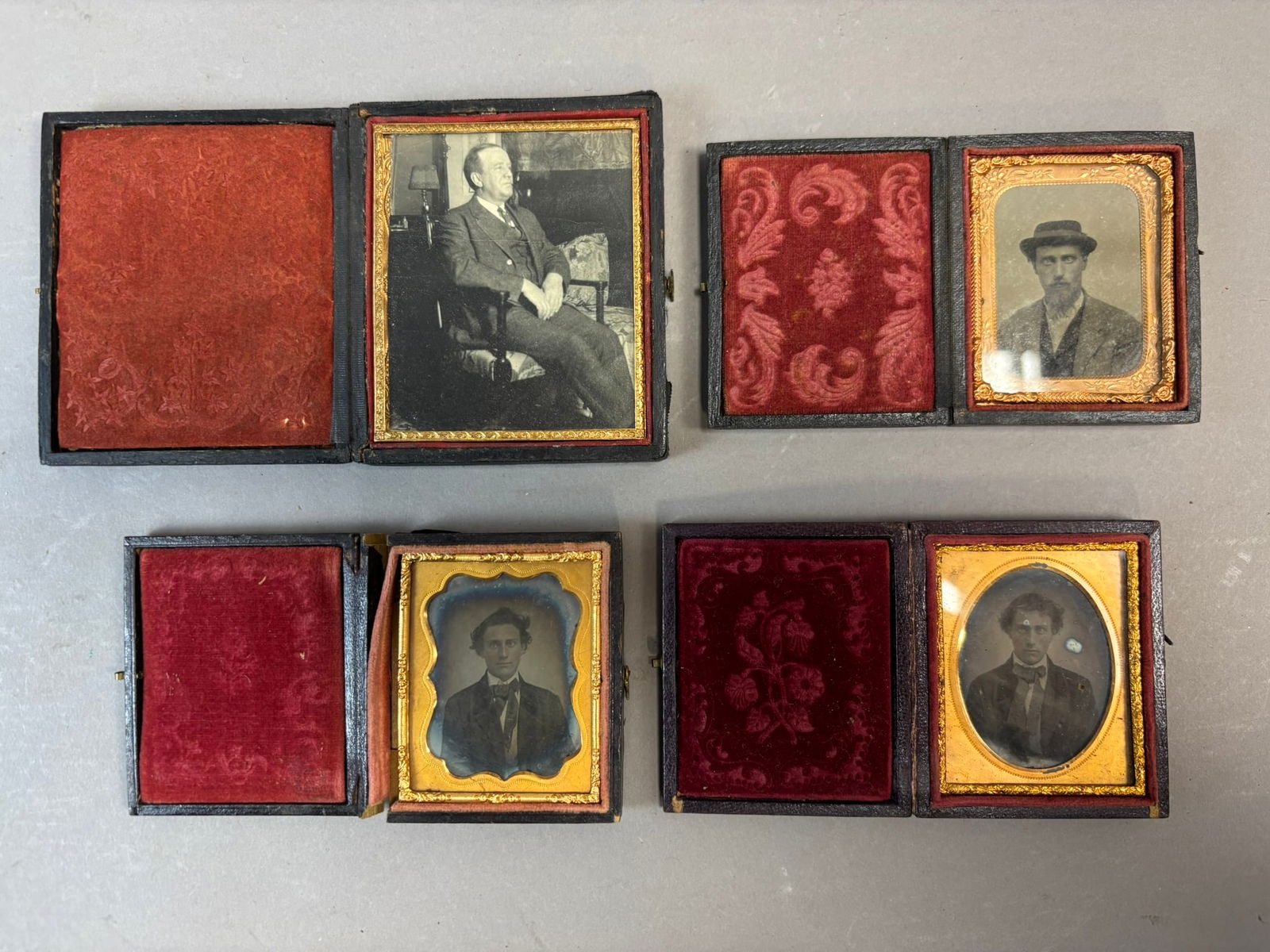4 Antique Cased Photographs Daguerreotype Tintype Ambrotype Portraits: Group of four mid-19th century cased portrait photographs including daguerreotype, ambrotype and tintype examples housed in period thermoplastic and leatherette cases. Portraits depict well dressed Vi