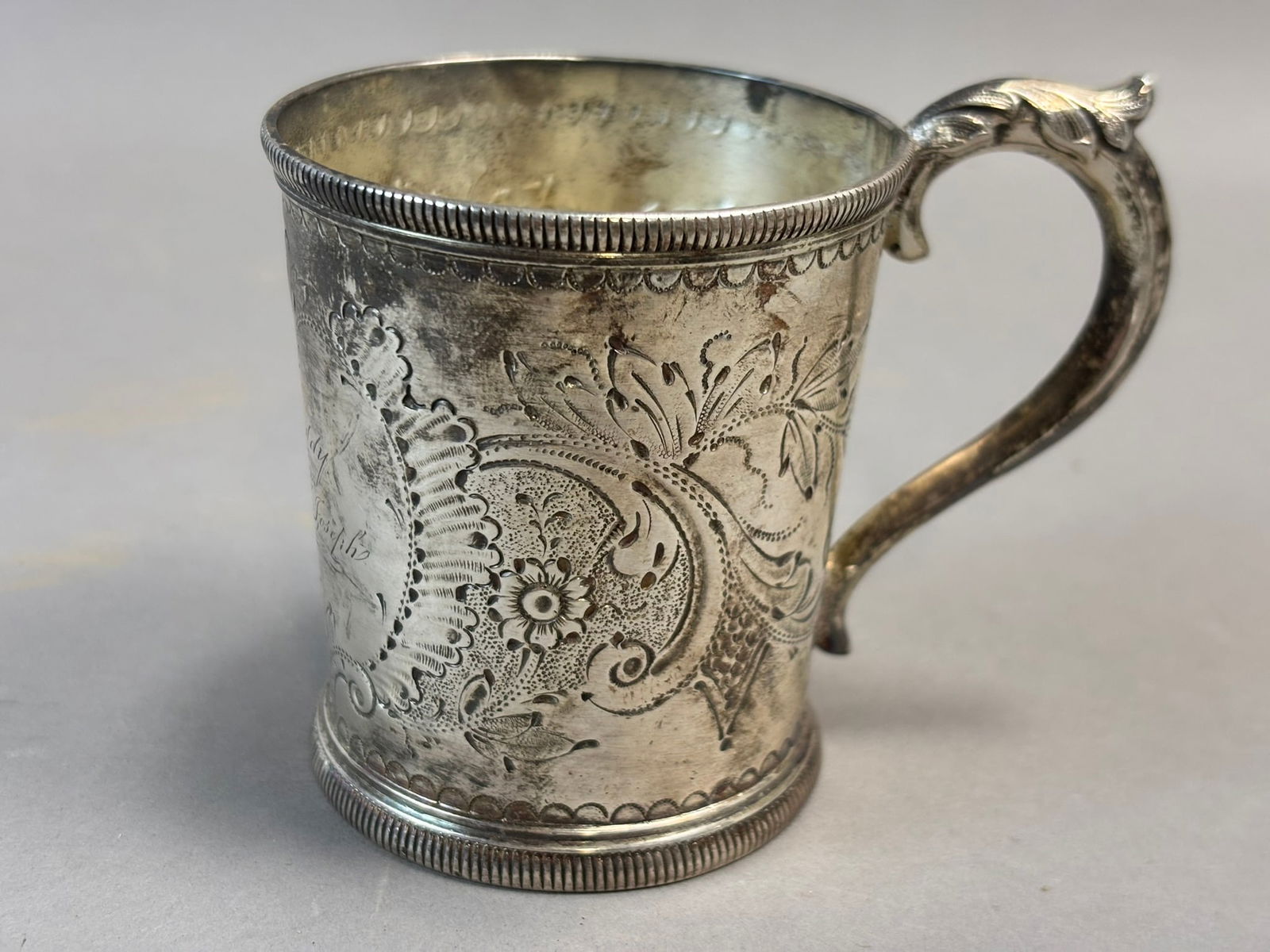 Early 19th C Sterling Silver Julep Cup Engraved Freddy Uncle Joseph: Early 19th century sterling silver julep cup of classic American form featuring a finely hand chased floral and scroll decorated body with molded borders and an applied handle, the interior gilt washe