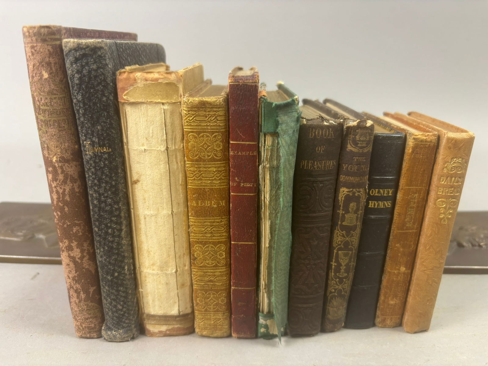 Antique Religious Books Hymnals Devotional Theology Group 19th Century: Collection of antique religious and devotional books including titles such as Examples of Piety featuring biographies of Richard Baxter, John Bunyan, Isaac Watts and Jonathan Edwards (1827), The Chris