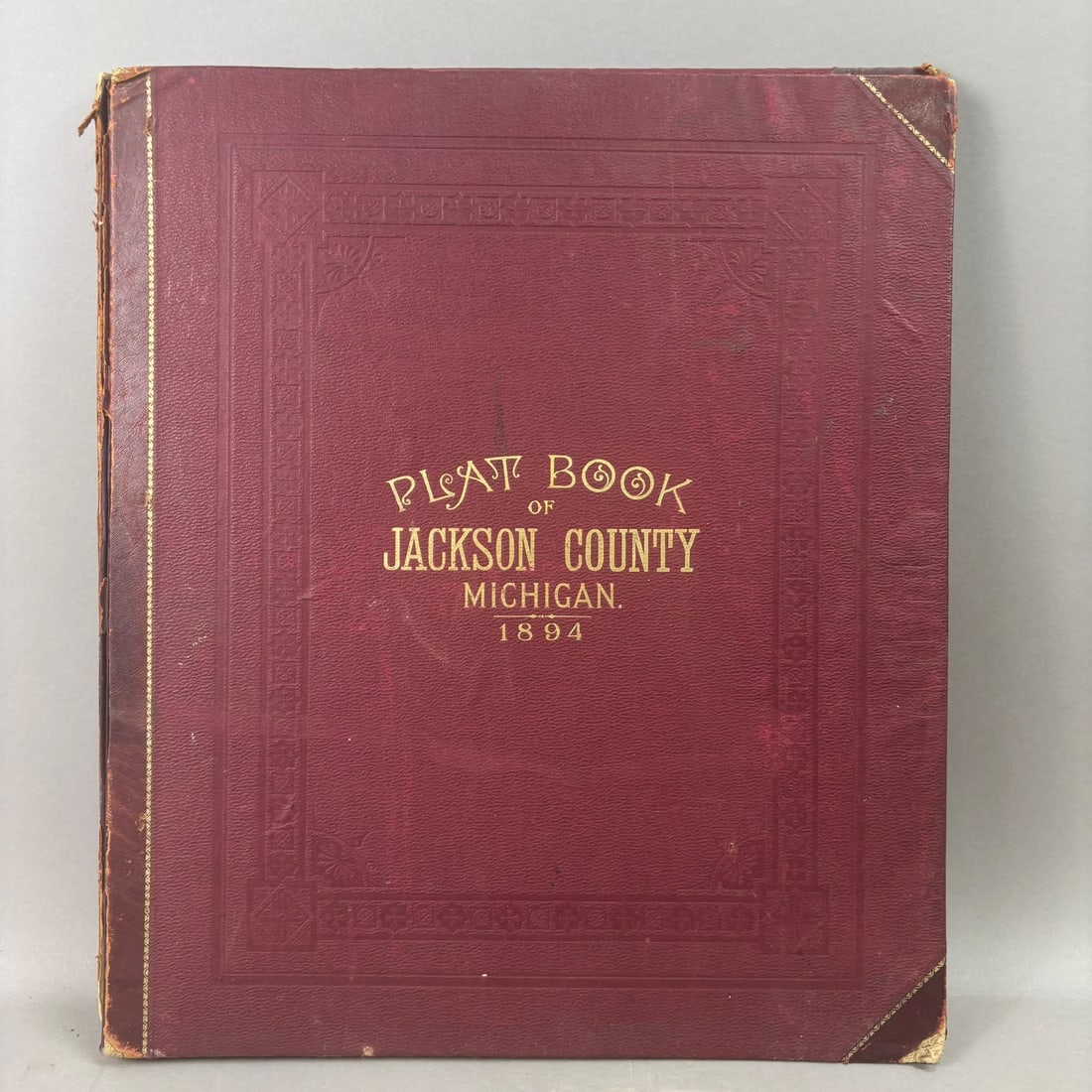 1894 Jackson County Michigan Plat Book Atlas Maps American Atlas Co: Large folio Plat Book of Jackson County Michigan compiled and published by the American Atlas Company, Chicago, 1894. Bound in original red gilt-stamped cloth boards with decorative borders and corner