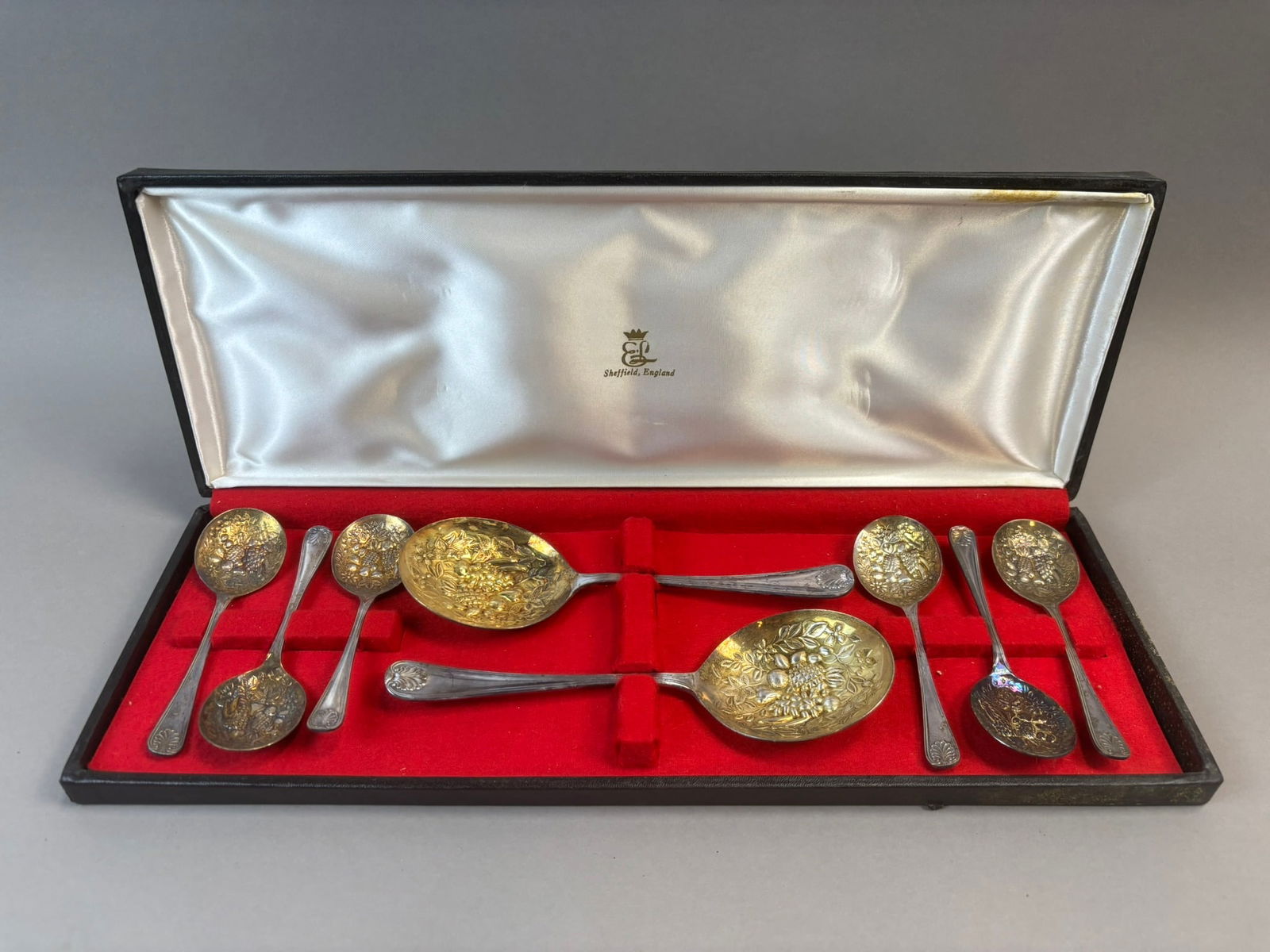 Sheffield England EPNS Fruit Motif Serving Spoon & Demitasse Spoon Set: Vintage Sheffield England EPNS silverplate serving set including two large serving spoons and six smaller spoons featuring embossed fruit and floral motif bowls with classic shell pattern handles. Mar