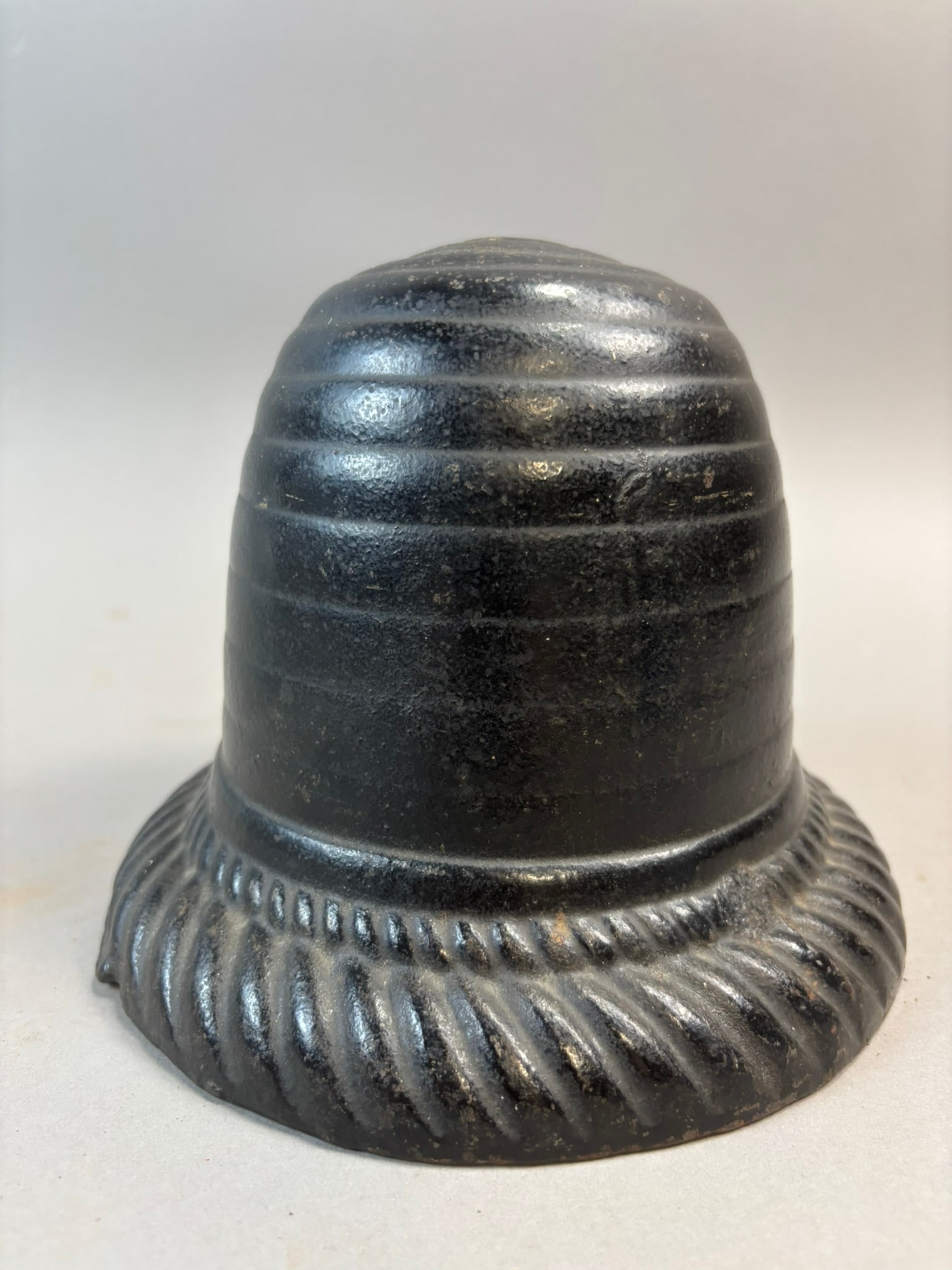 Cast Iron Beehive String Holder Twine Dispenser General Store Countertop: Antique cast iron beehive form string holder or twine dispenser, a classic general store countertop utility used for dispensing wrapping twine for packages and parcels. The piece features a ribbed bee