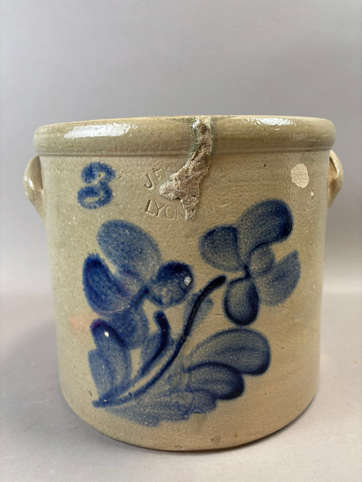 Antique J.F.C. & Co Lyons NY 3 Gallon Cobalt Decorated Stoneware Crock: 19th century three-gallon stoneware crock impressed “J.F.C. & Co. / Lyons, N.Y.” and decorated with a bold hand-painted cobalt floral motif and capacity mark “3.” This example