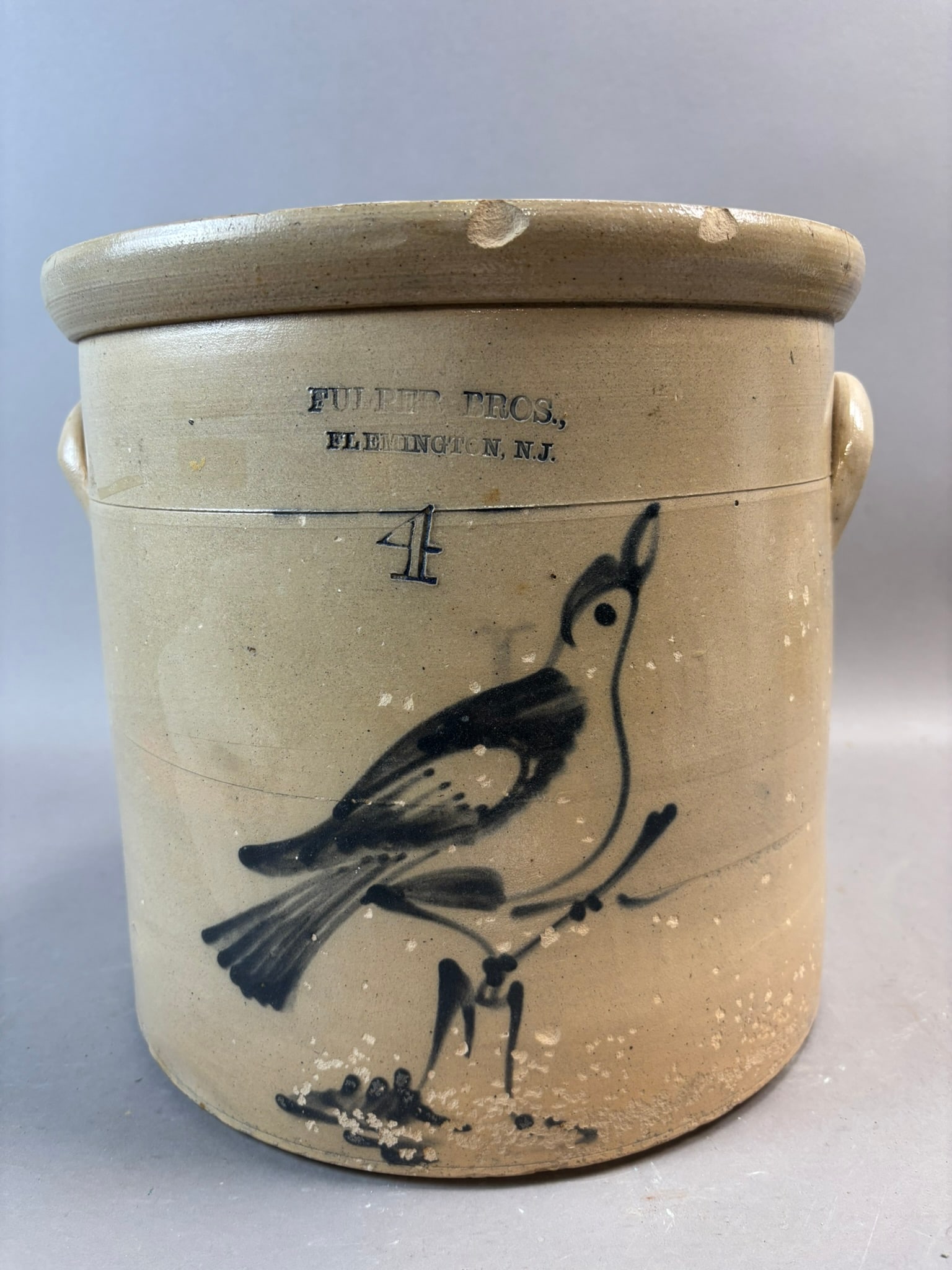 Fulper Bros Flemington NJ Stoneware Crock Bird Decoration 4 Gallon: Antique American stoneware crock impressed “Fulper Bros., Flemington N.J.” featuring a bold cobalt hand decorated bird perched on a branch beneath the incised “4” gallon capaci