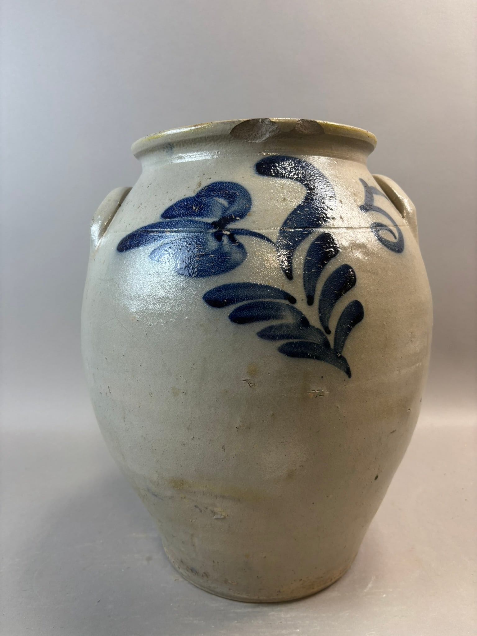 Antique Stoneware 5 Gallon Ovoid Jar Cobalt Floral Decor Albany Slip Interior: Antique American stoneware ovoid jar featuring bold hand-painted cobalt floral decoration on the shoulder, applied lug handles, and dark Albany slip glazed interior. This example has an attractive bul