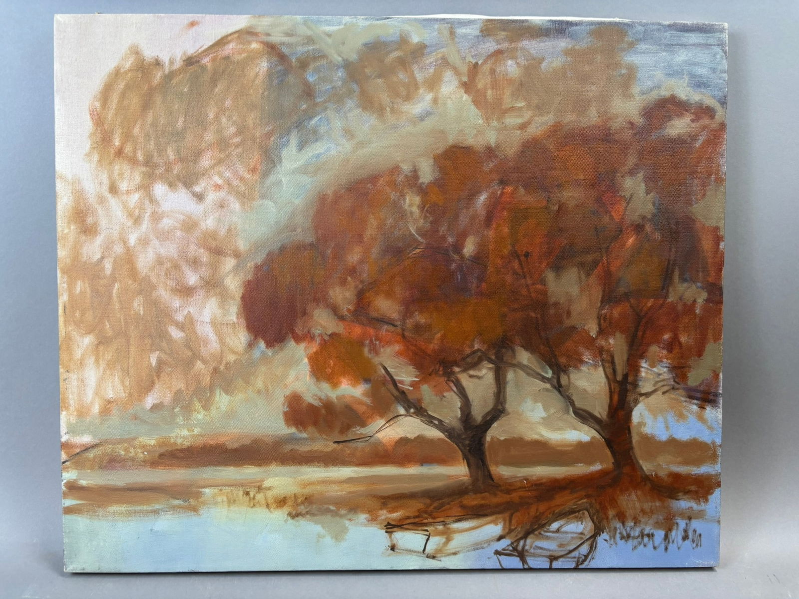 Henry Schafer Jackson MI Autumn River Landscape Oil Painting Canvas 24x20: Original oil on canvas landscape painting by Jackson, Michigan artist Henry Schafer depicting a peaceful autumn riverside scene with two trees in warm rust and orange foliage overlooking a calm reflec