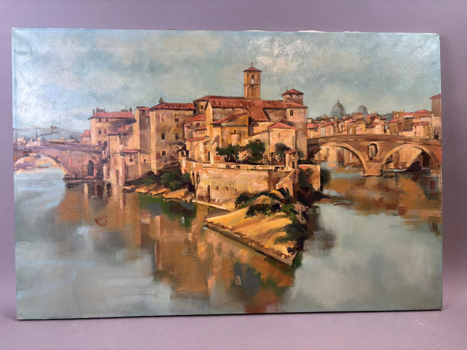 Schafer Italian City Bridge River Landscape Oil Painting Rome Scene 36x24: Original oil on canvas painting by Jackson, Michigan artist Henry Schafer depicting a picturesque Italian riverside cityscape with historic stone buildings, tiled rooftops, and an arched masonry bridg
