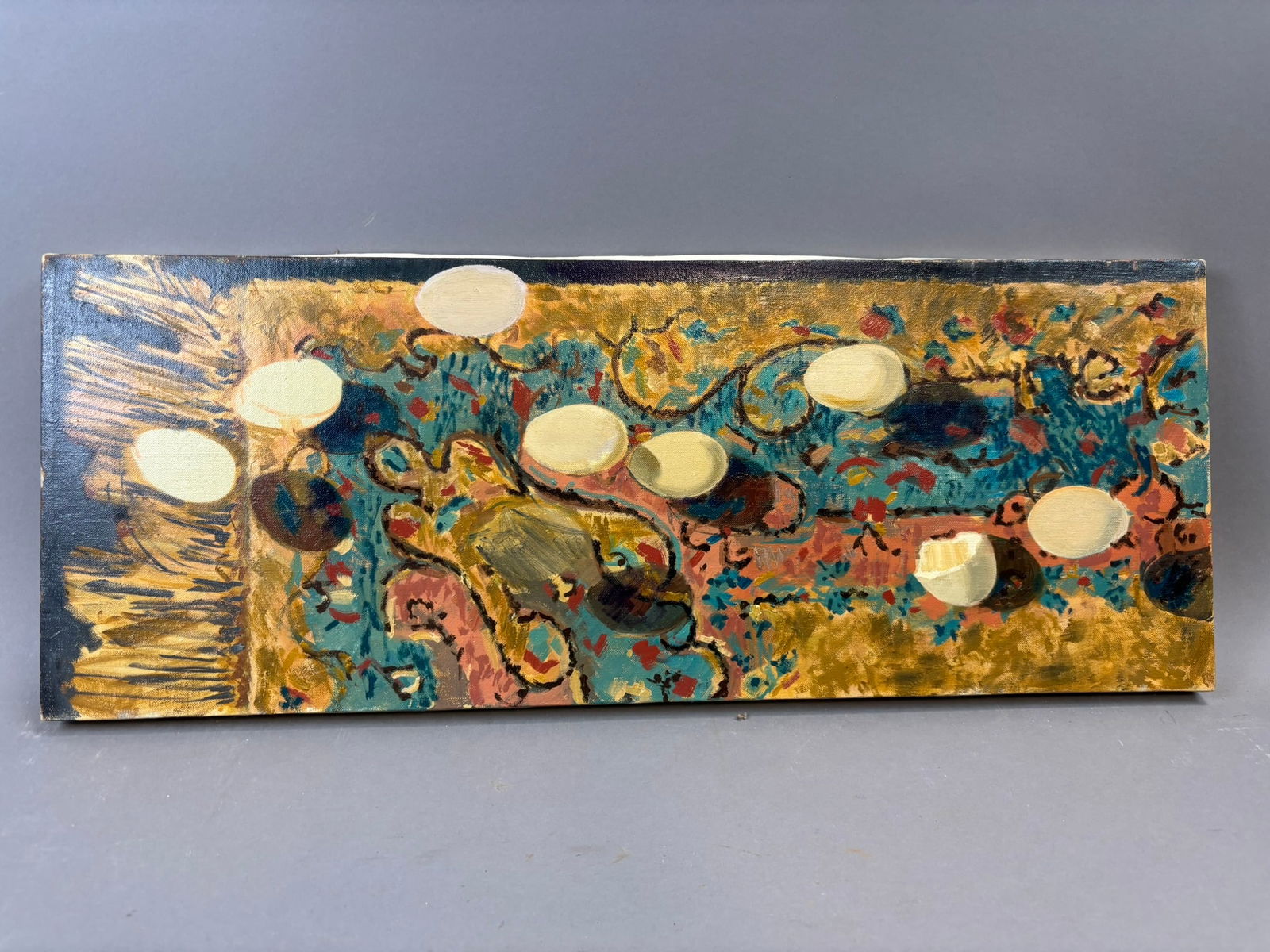 Modernist Oil Painting Abstract Still Life Eggs Pattern Cloth 26x10 Canvas: Original oil on canvas still life by Jackson, Michigan artist Henry Schafer depicting several eggs arranged across a vividly patterned cloth rendered in expressive, abstract brushwork. The composition