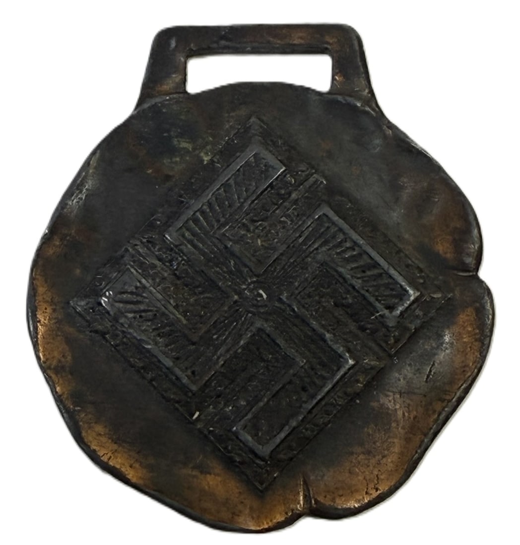 Drink Coca Cola In Bottles 5 Cent Good Luck Key Fob w/ Swastika: Vintage Coca-Cola advertising fob, crafted from metal with a patinated finish. The front features a geometric design with intricate detailing, while the reverse is stamped with the text 'Drink Coca-Co