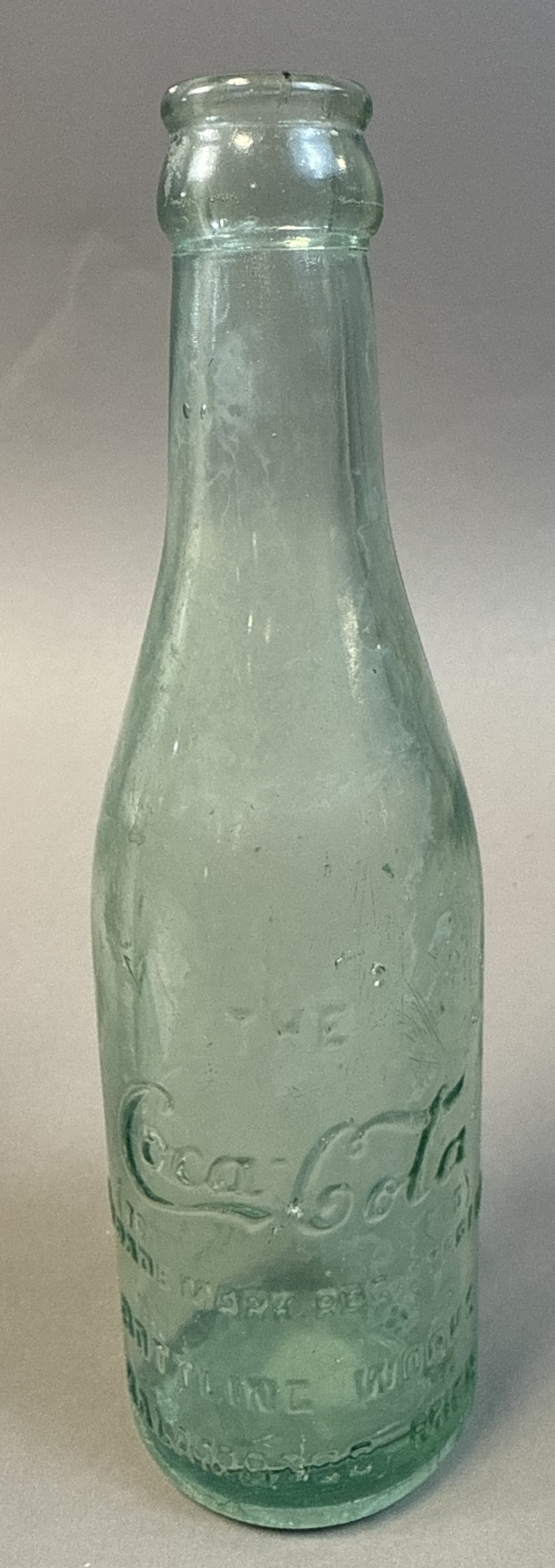 Coca-Cola Aqua Glass Bottle Script Embossed Kalamazoo MI Early 1900s: Early 20th century Coca-Cola aqua glass bottle featuring classic script embossing with ?The Coca-Cola Co.? and ?Bottling Works Kalamazoo Mich? lettering, straight-sided form typical of pre-contour bot